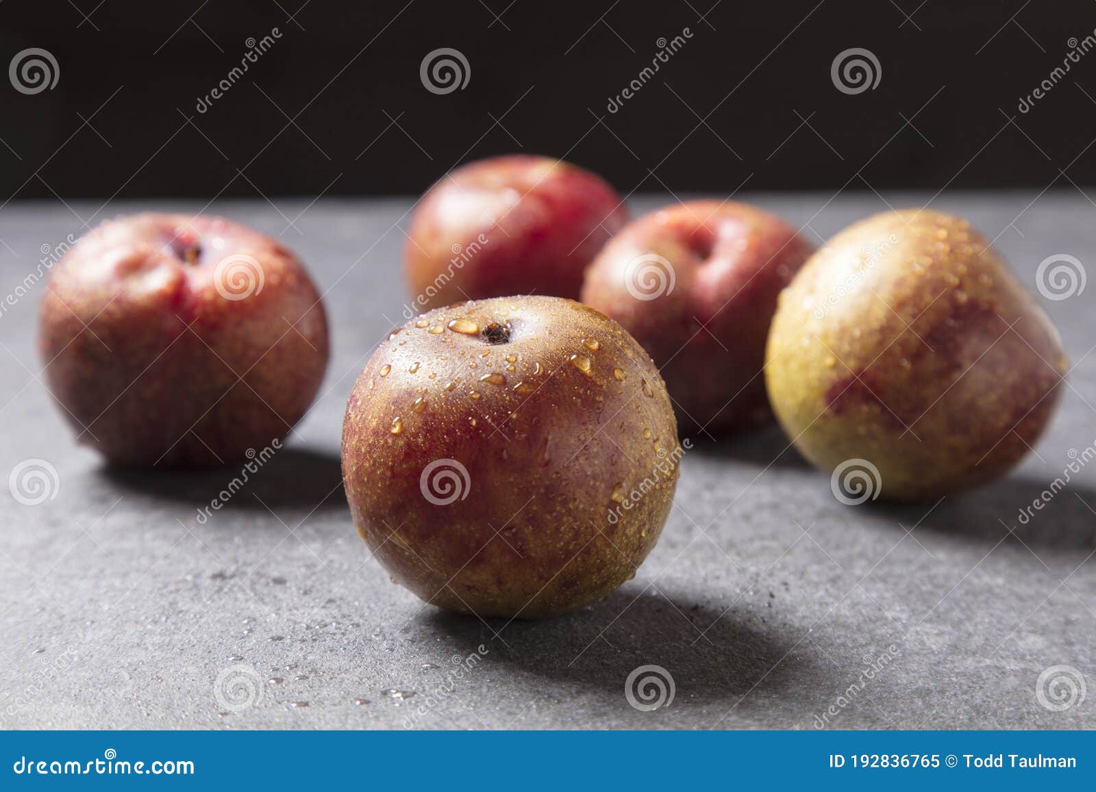 pluots on grey granite background