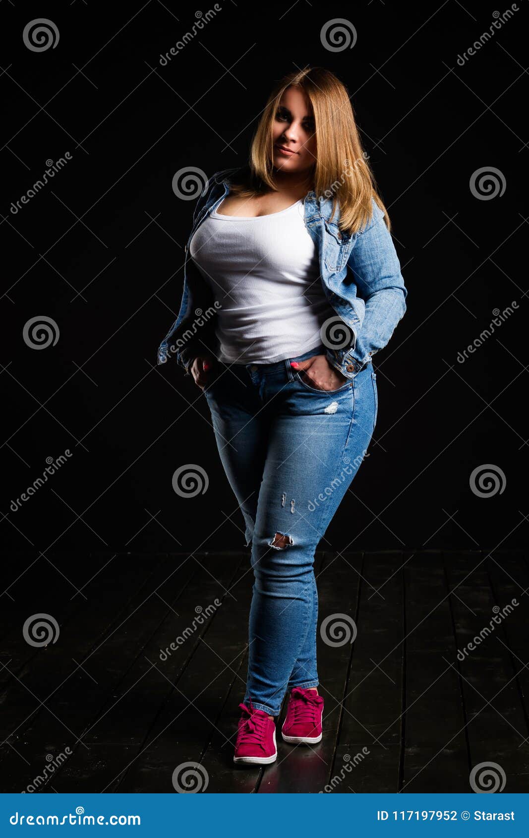 Plus Size Fashion Model in Blue Jeans, Fat Woman on Black Studio