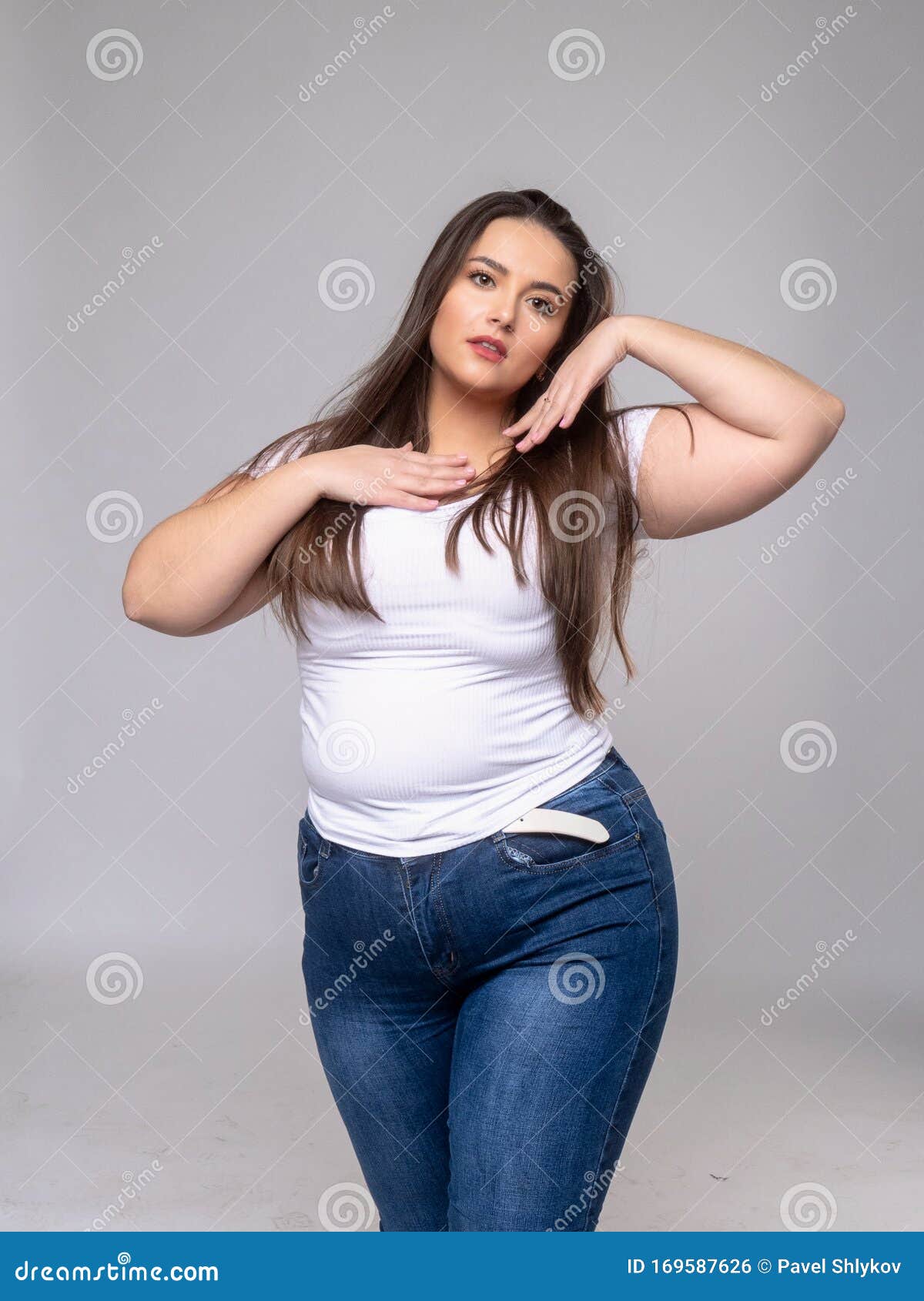 Plus Size Model with Long Hair Posing in Studio Stock Photo - Image of ...