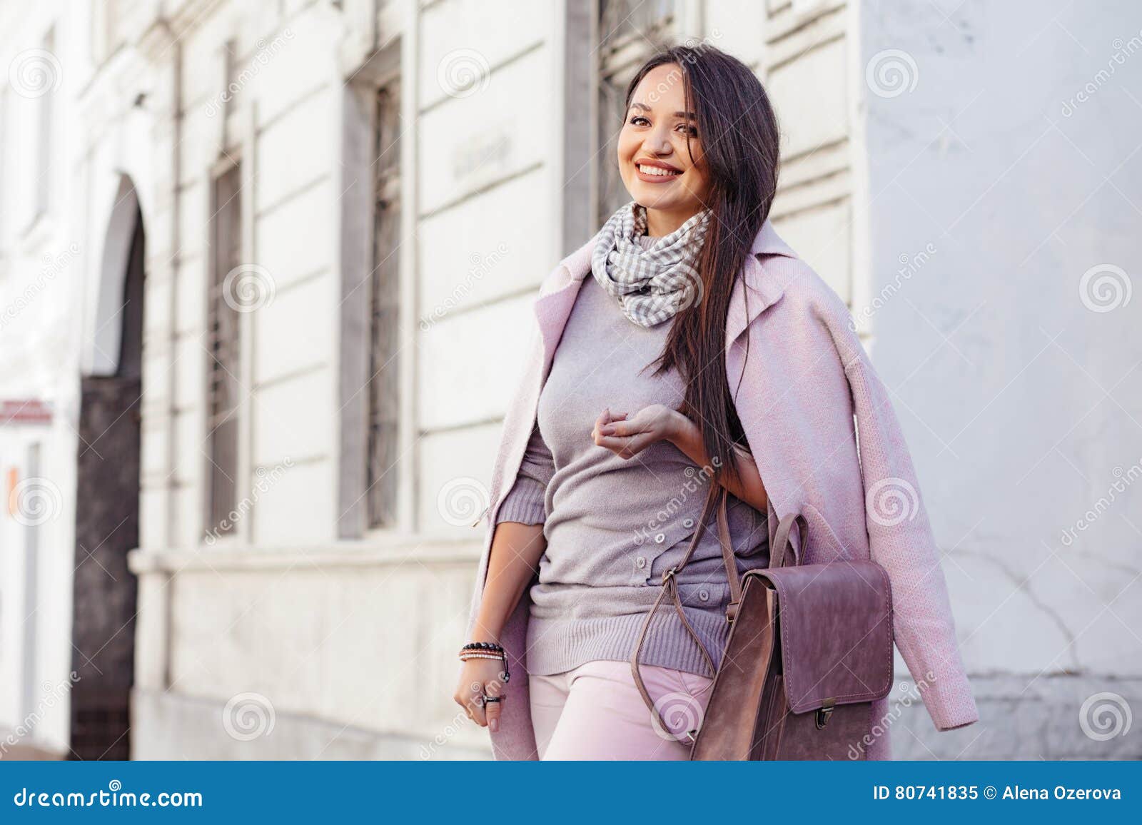 plus size model in pink coat