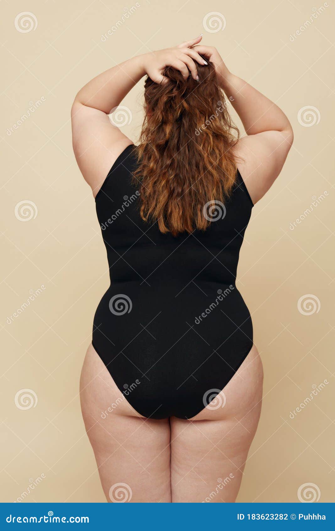 Plus Size Models. Full-figured Women Full-Length Portrait. Brunette And  Blonde In Black Bodysuits Posing On Beige Background. Body Positive  Concept. Stock Photo