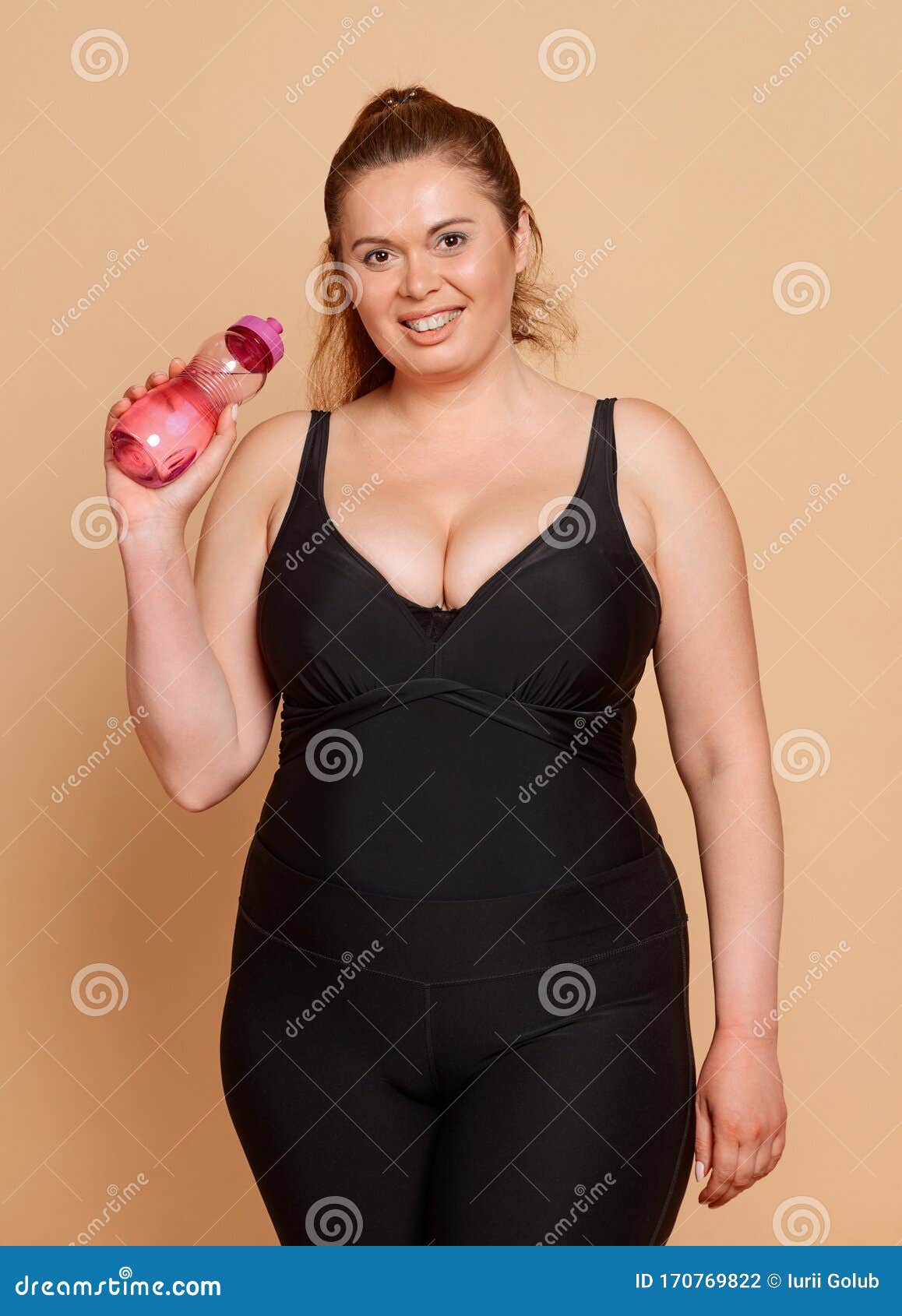 Plus Size Woman Dressed in Black Body Suit and Holding a Bottle of Water  Stock Photo - Image of cute, jump: 170769822