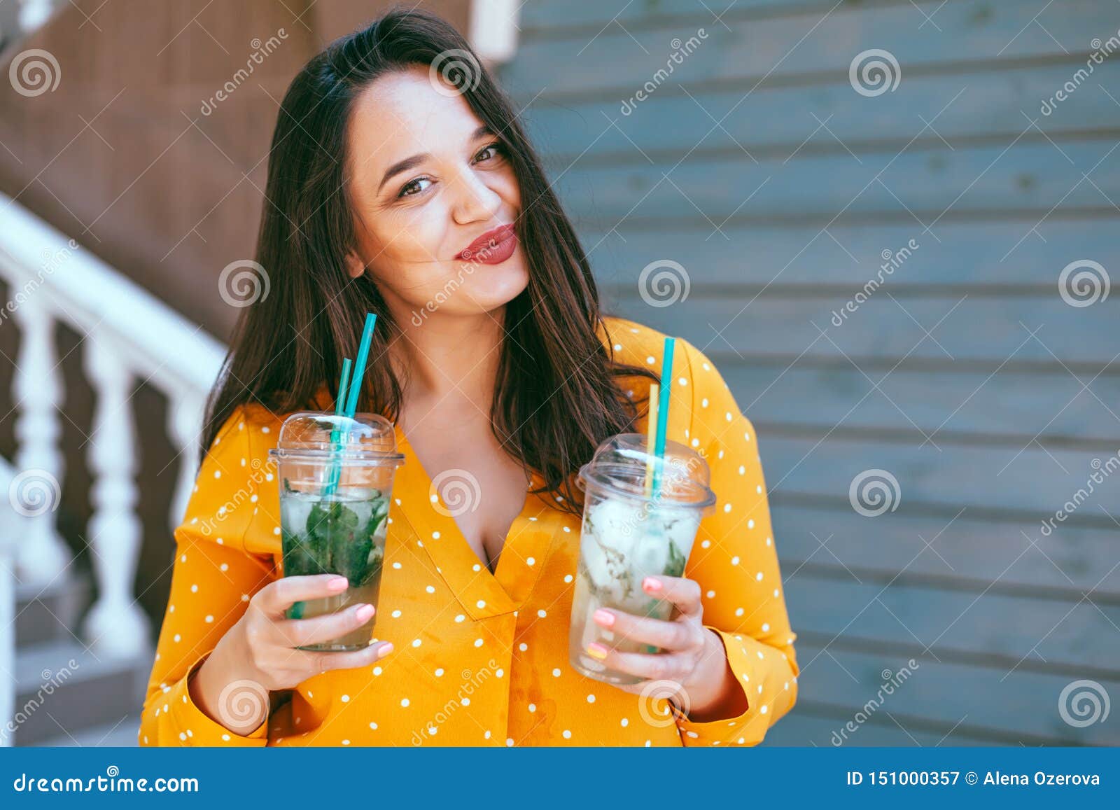 Plus Size Woman Drinking Take Away Cocktail Over City Cafe Wall Stock ...