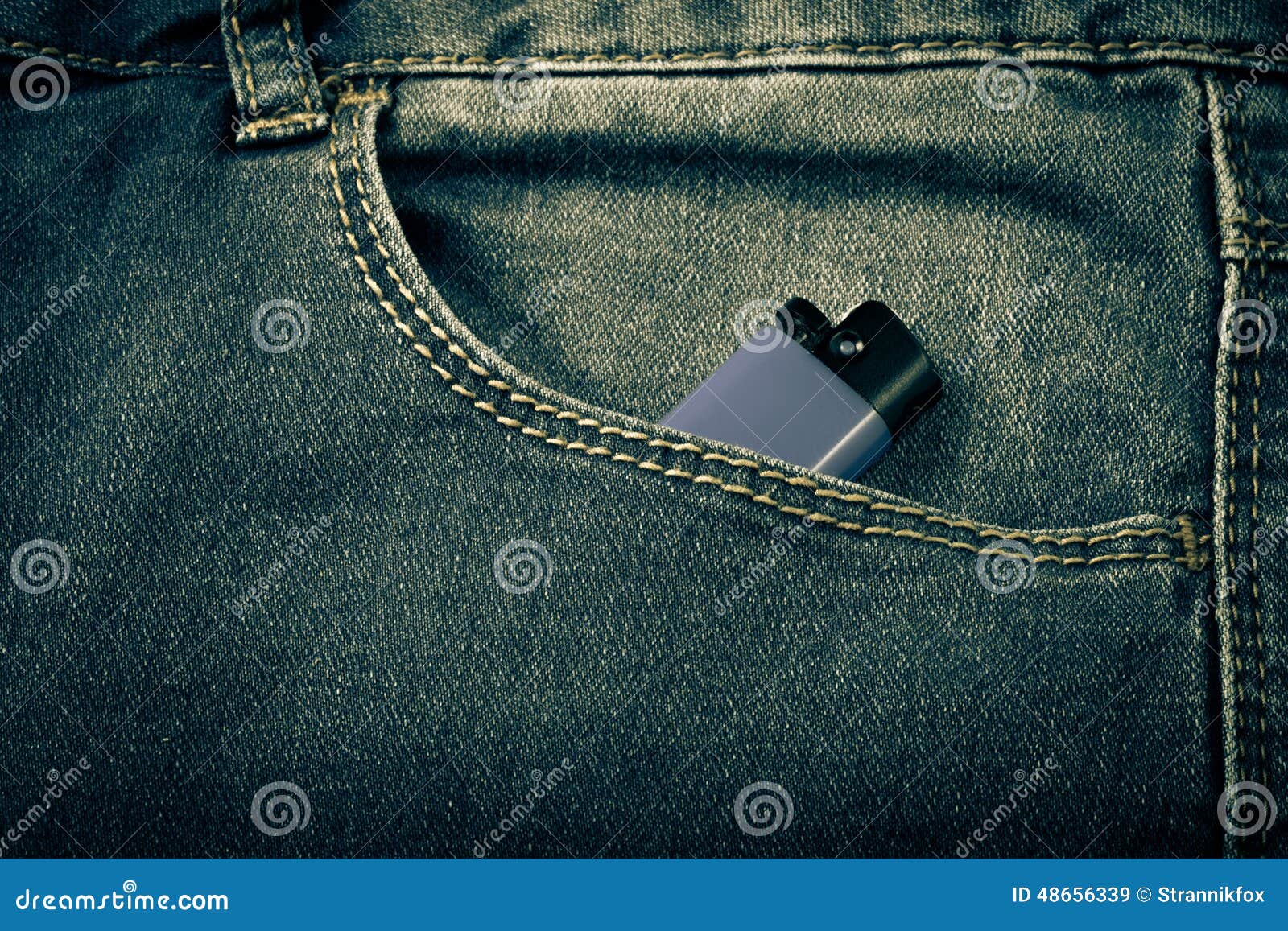 The Pocket of Jeans with Lighter. Cloth Background Stock Image Image