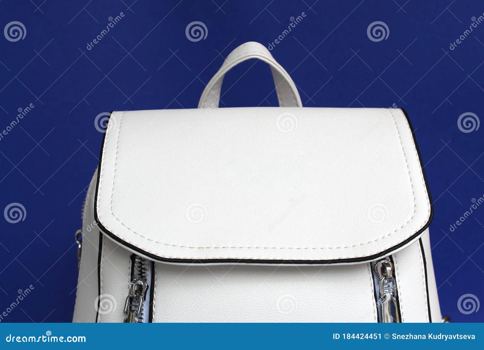 white bag backpack on a blue background