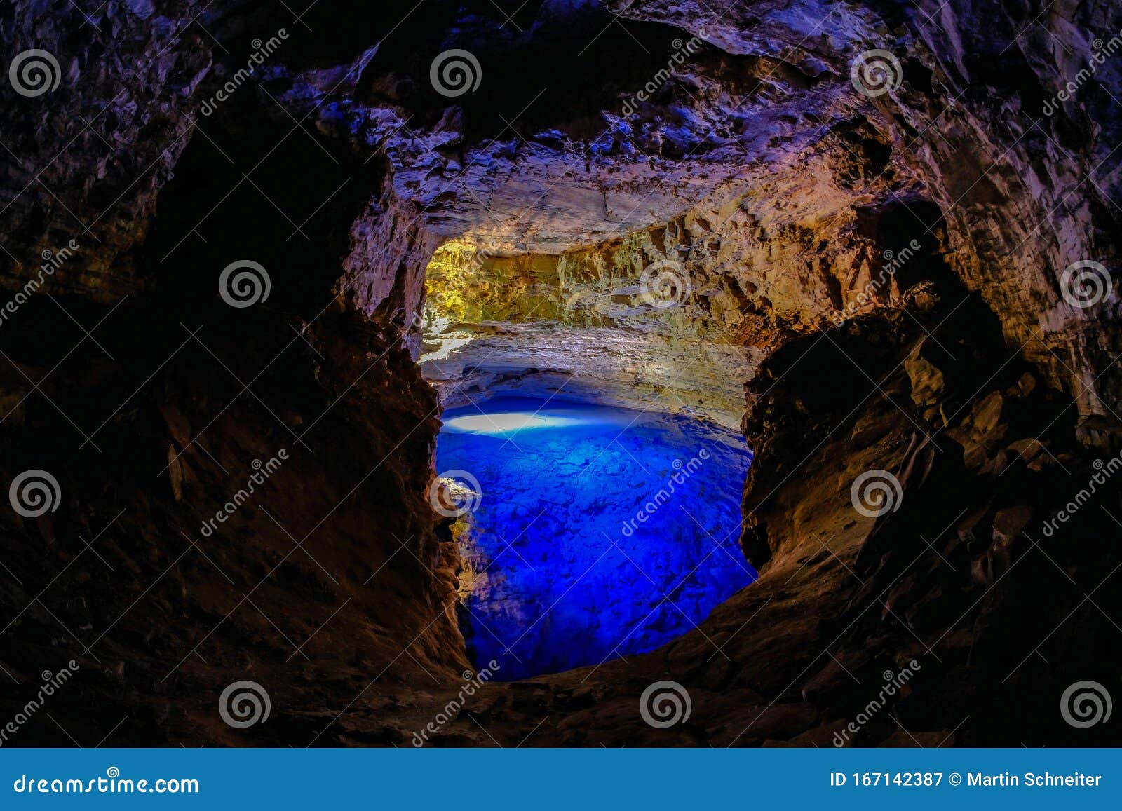 poco encantado, blue lagoon with sunrays inside a cavern in the chapada diamantina, andarai, bahia, brazil