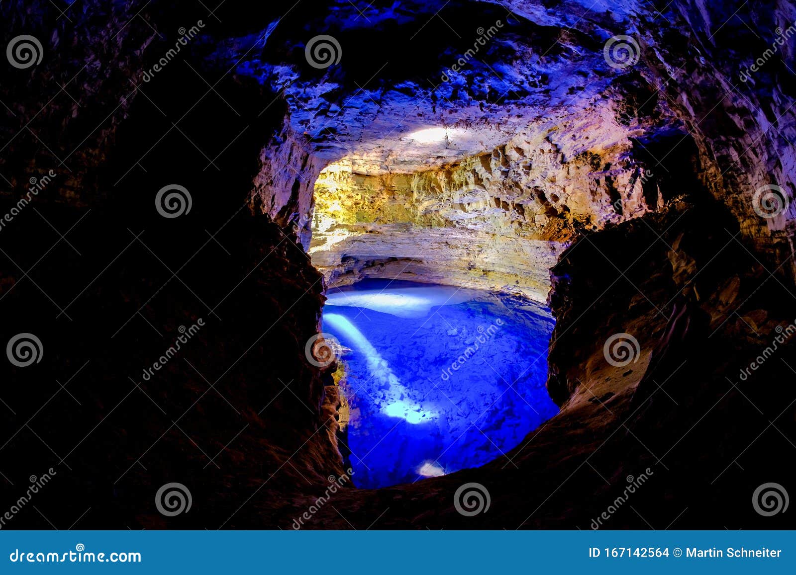 poco encantado, blue lagoon with sunrays inside a cavern in the chapada diamantina, andarai, bahia, brazil