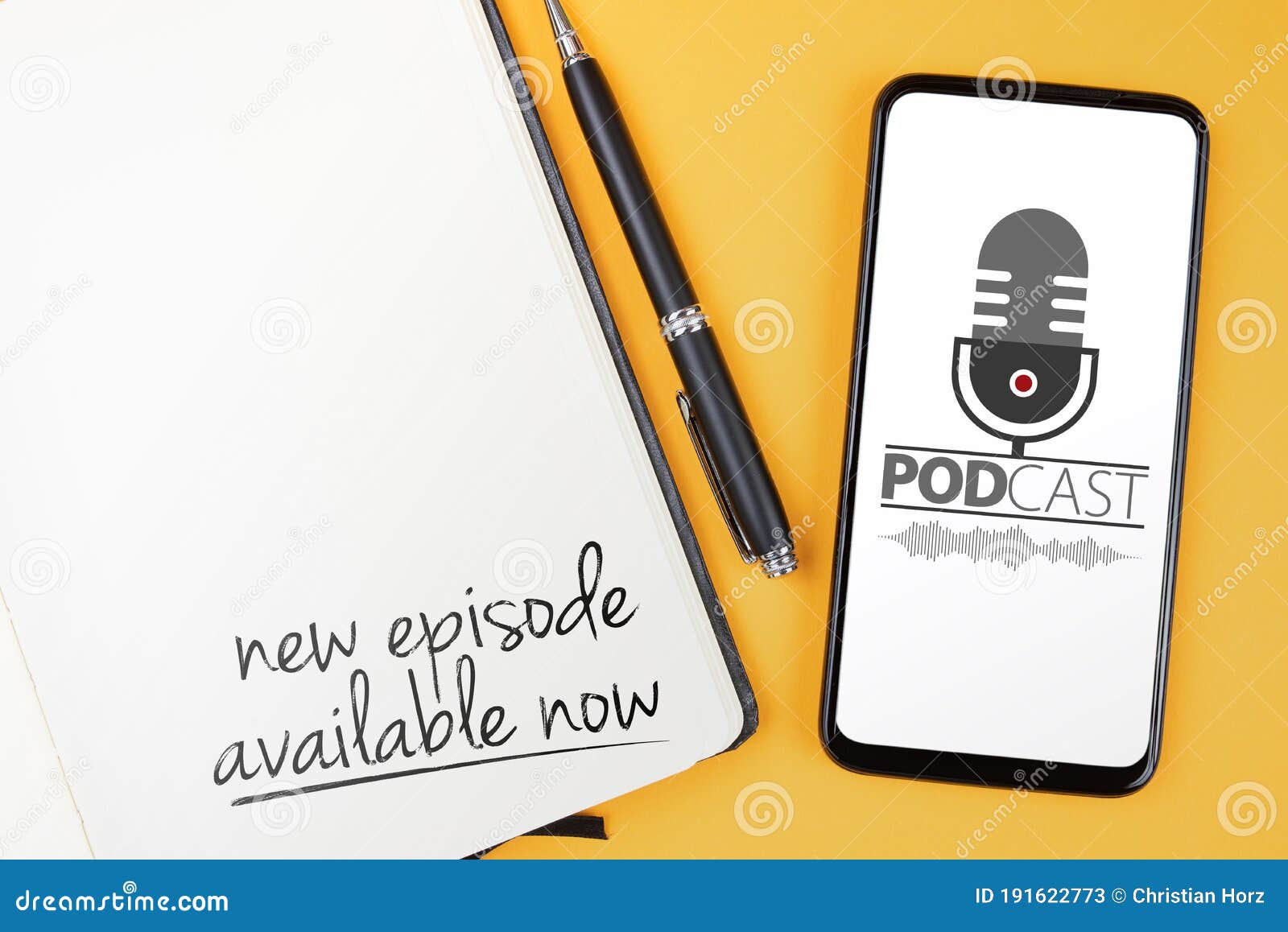 podcasting concept, text new episode available now written on note pad and smartphone with podcast player mockup