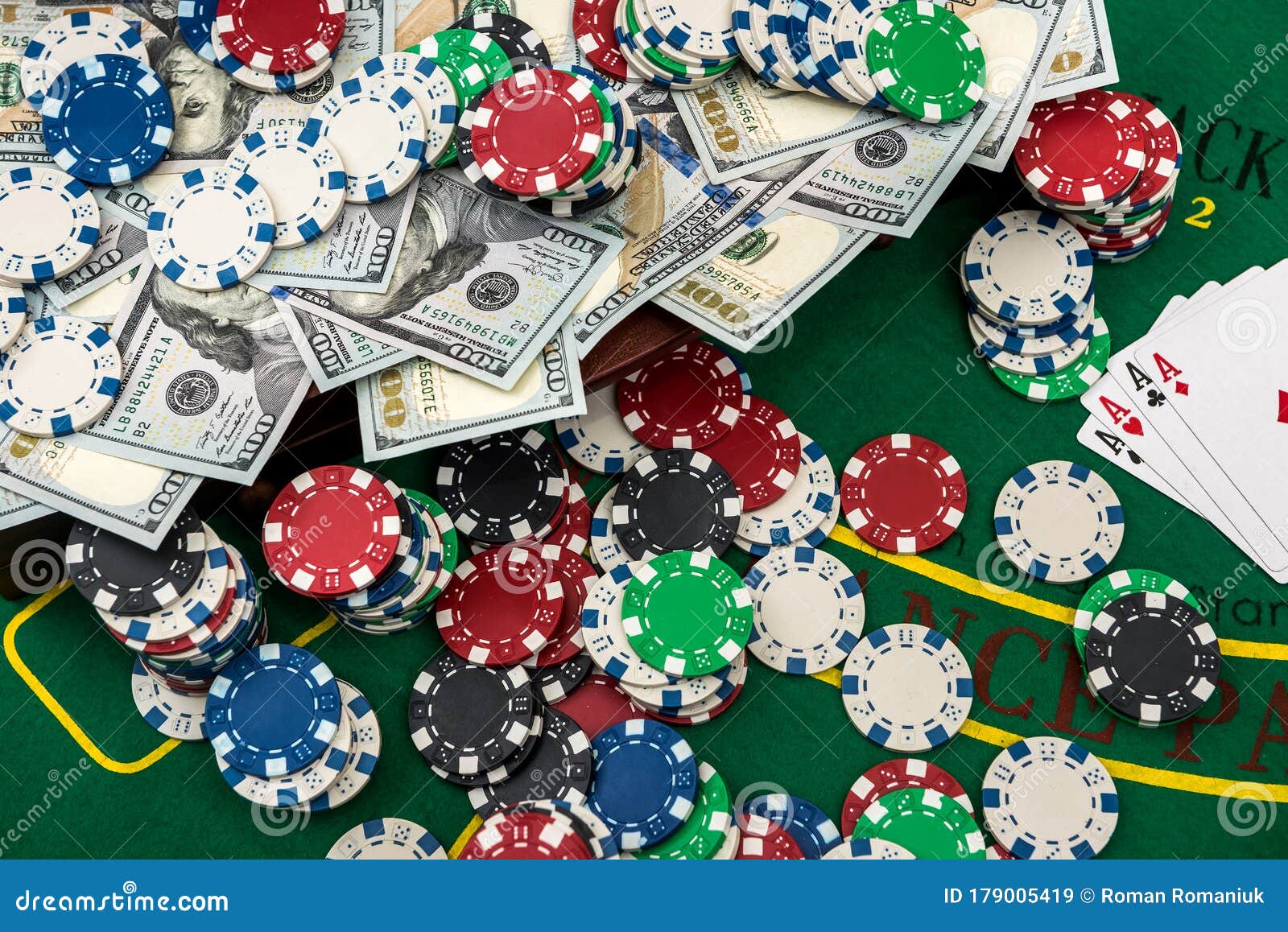 Poker Chips in the Case on a Gaming Table with Cards and Dollars Stock