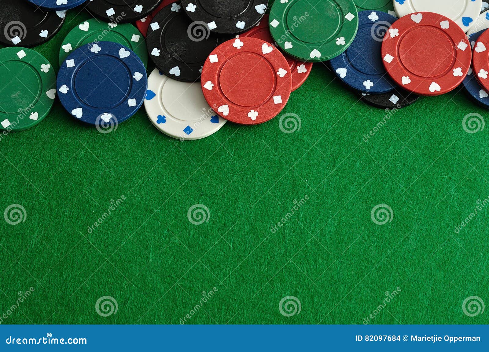 poker chips forming a borde with a green background