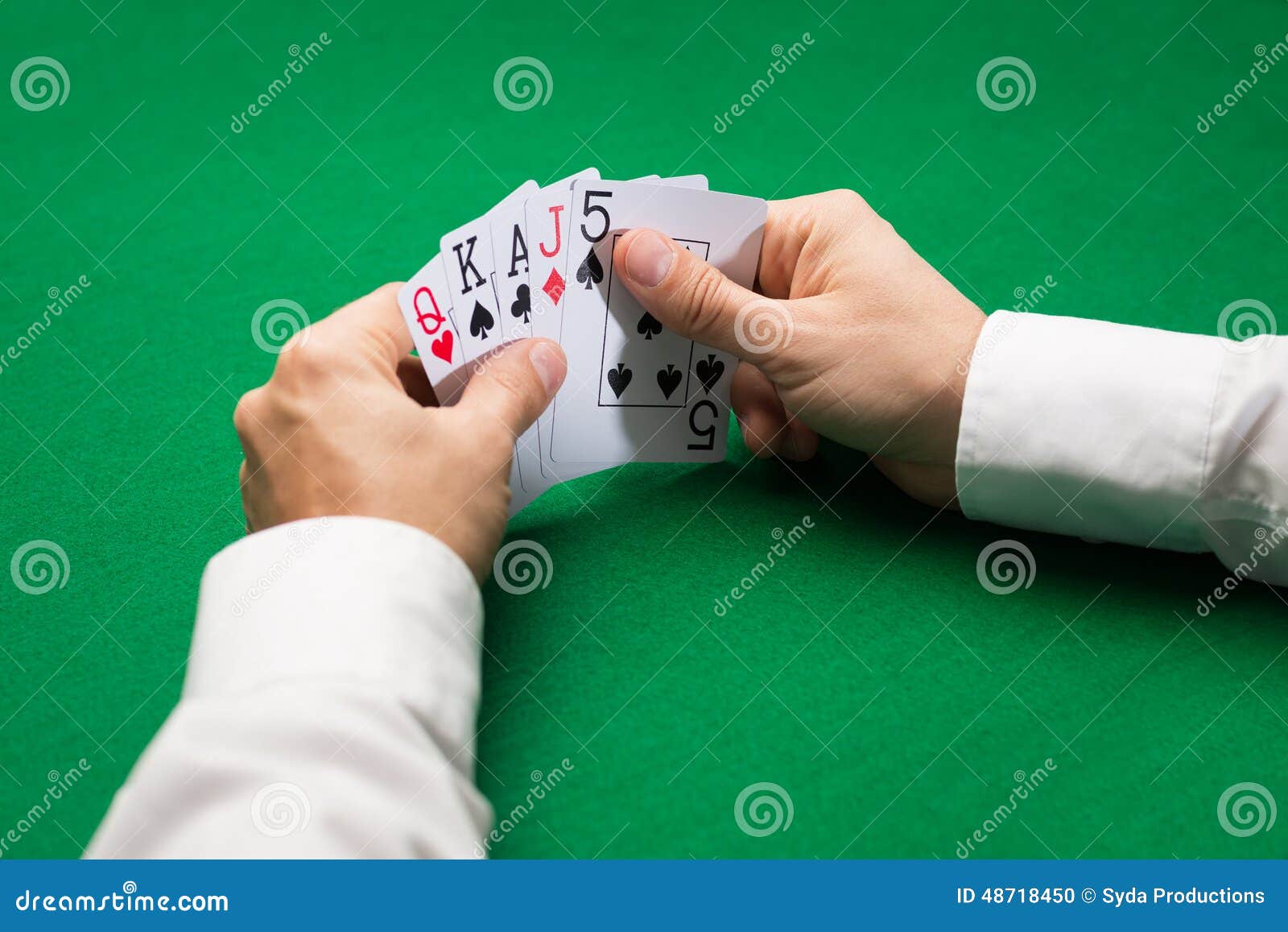 Poker Player Holding Playing Cards at Casino Table Stock Photo - Image ...