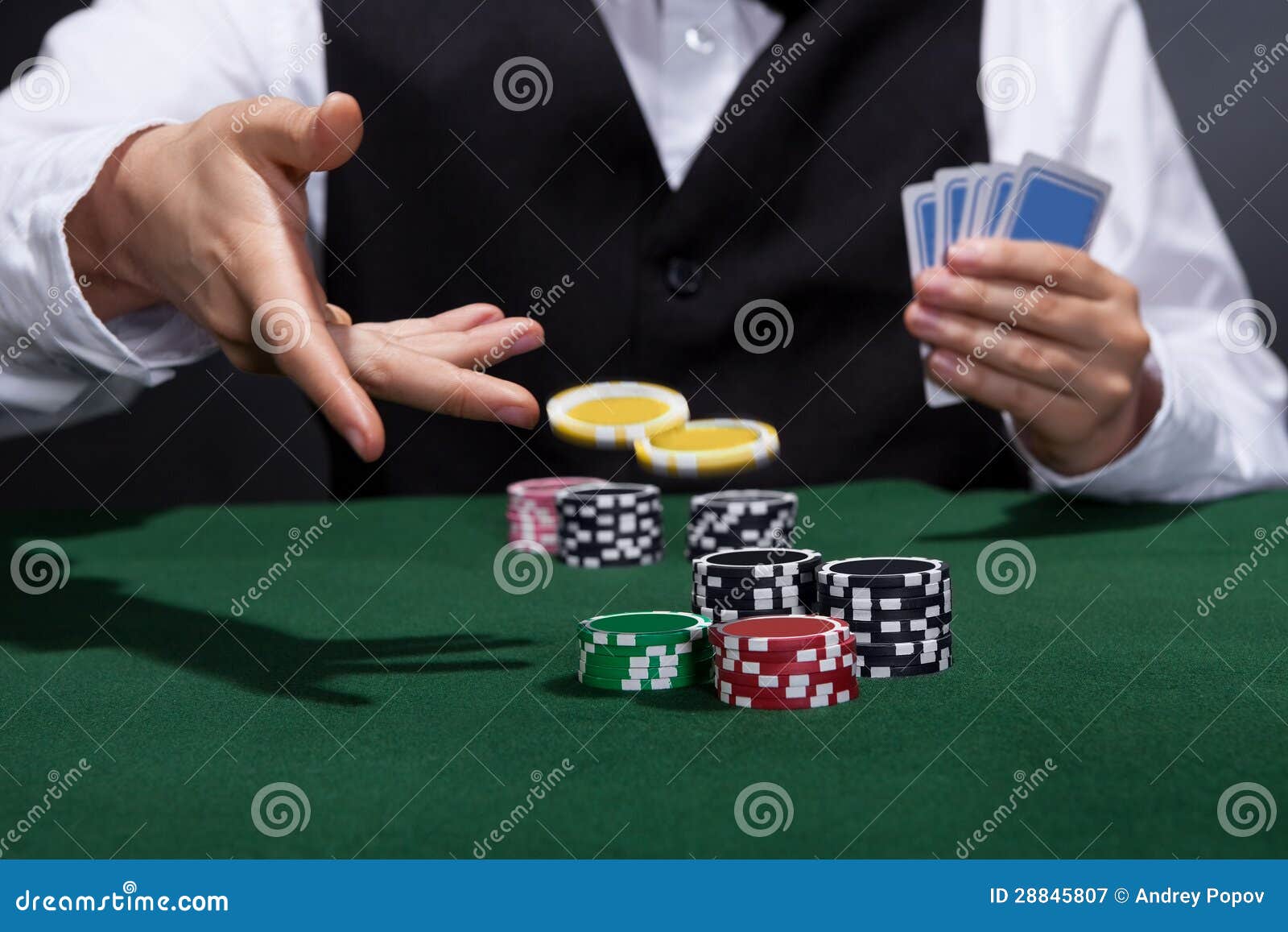 poker-player-increasing-his-stakes-28845807.jpg