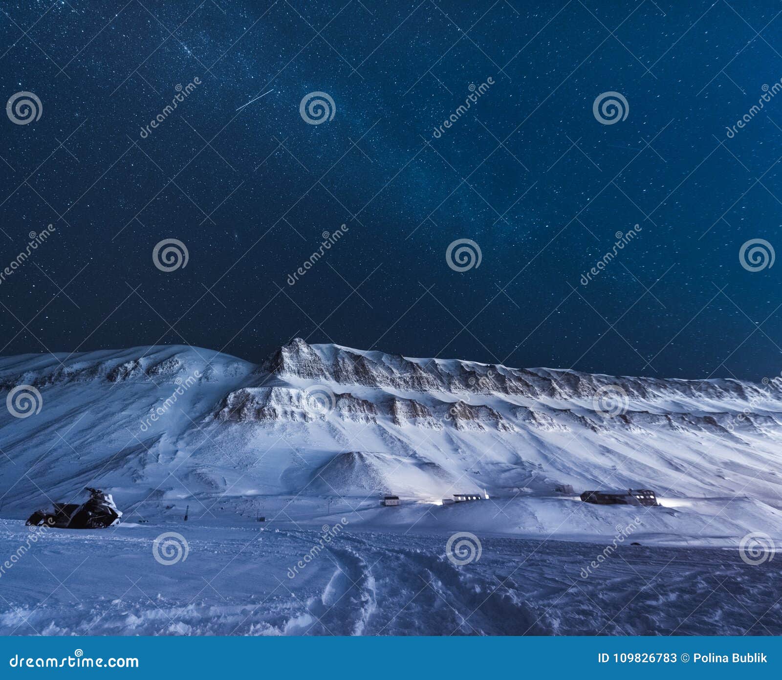 the polar arctic northern lights aurora borealis sky star in norway svalbard longyearbyen city snowscooter mountains