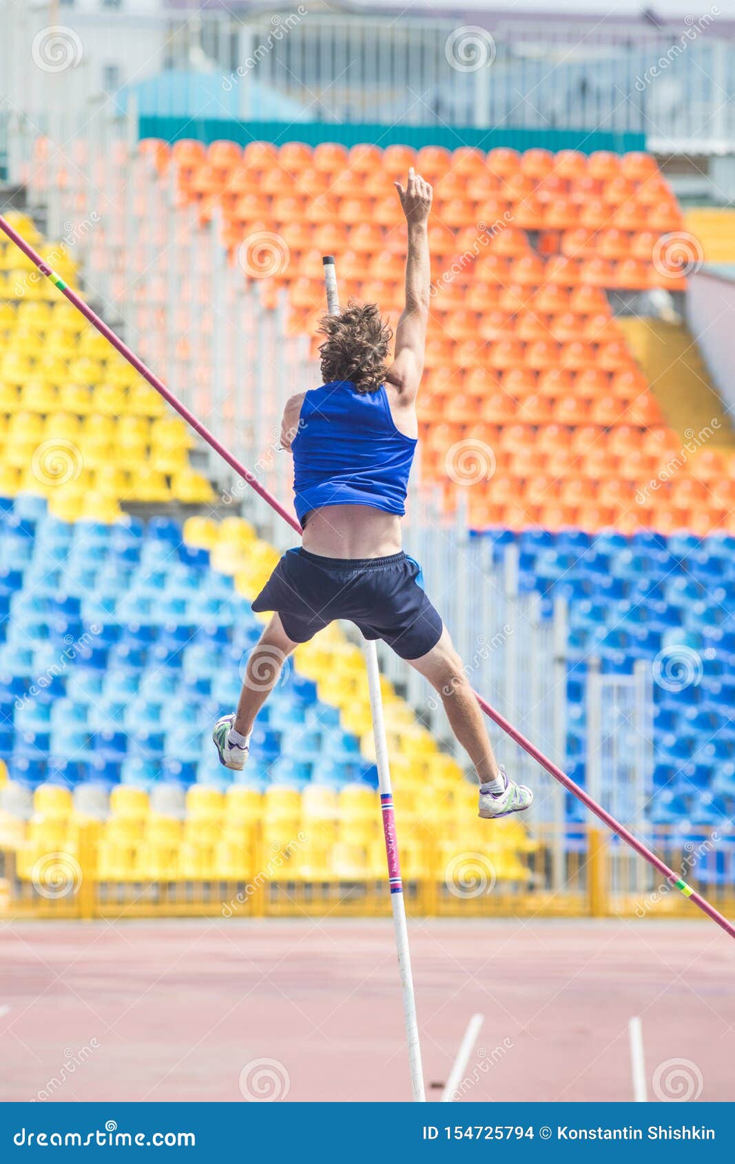 Pole Vault an Athletic Man Jumping Over the Bar Stock Photo Image of succeed, event 154725794