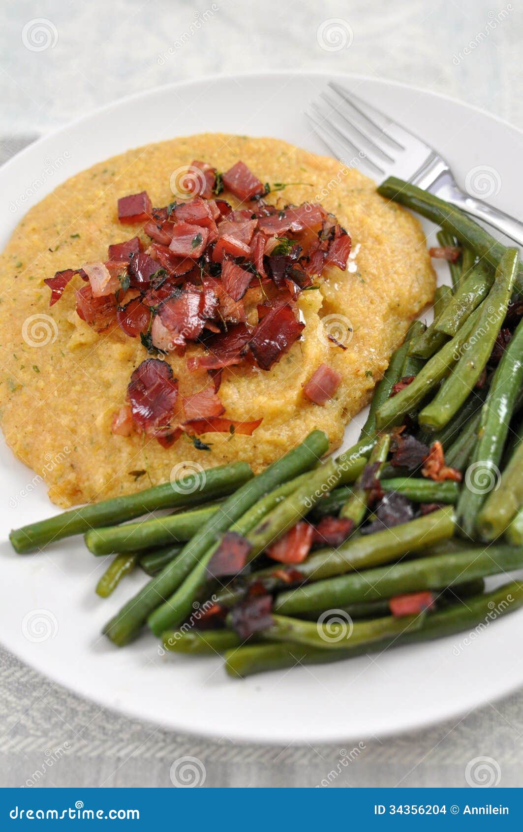 Polenta with green beans stock photo. Image of cornmeal 34356204
