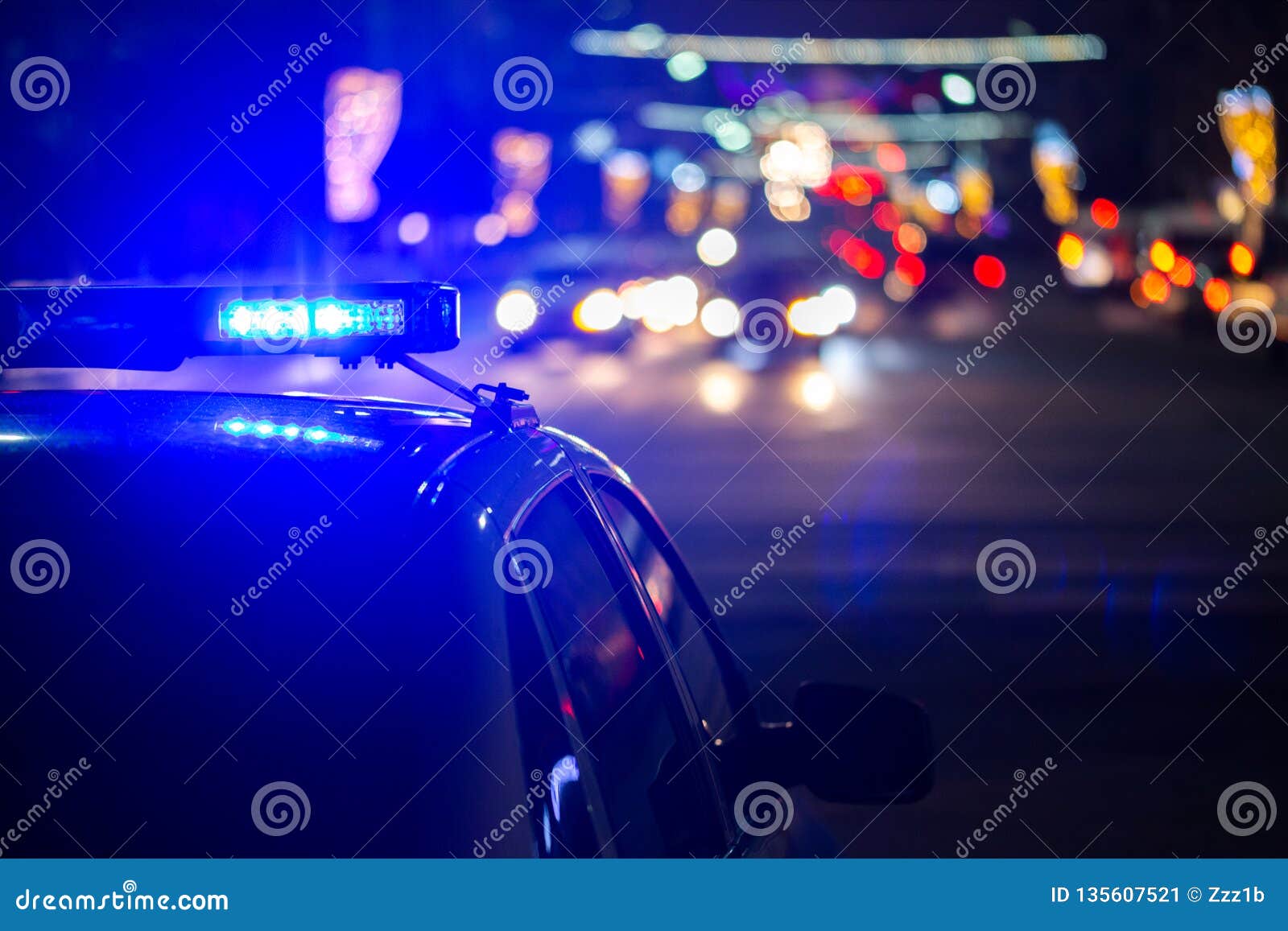 police car lights at night in city with selective focus and bokeh