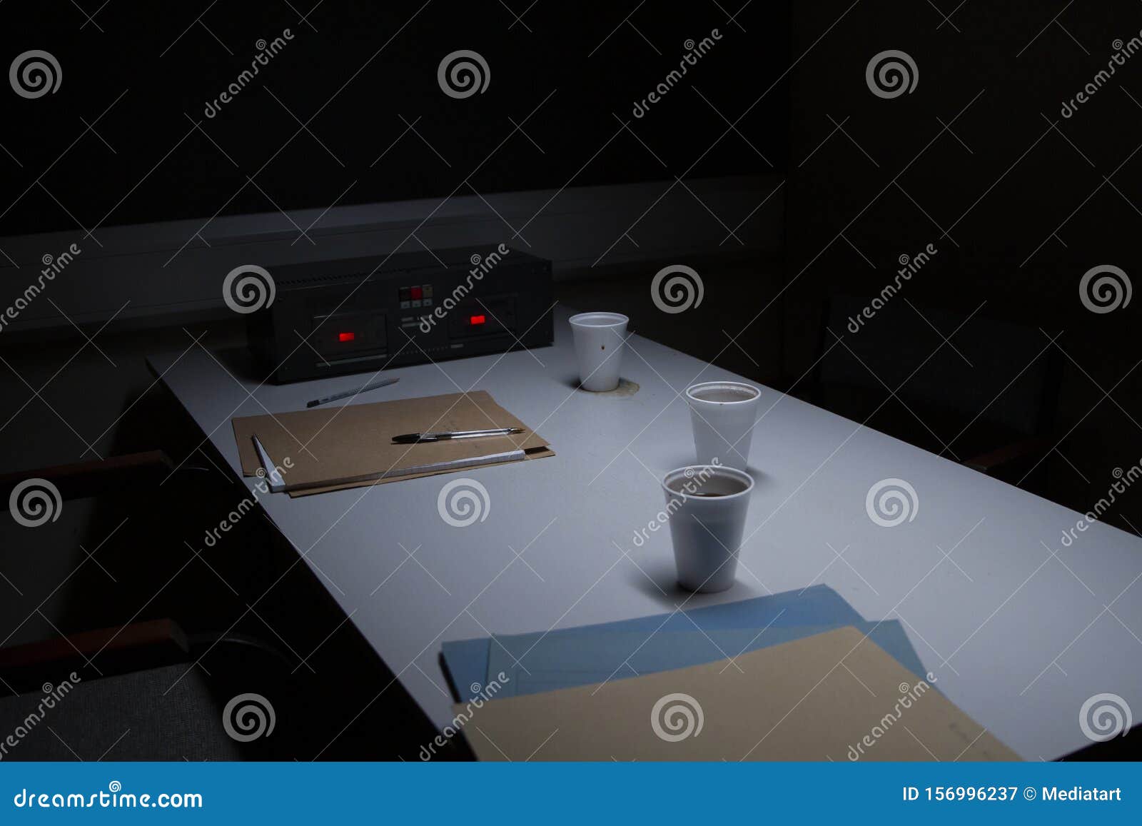 police custody interview room with coffee cups