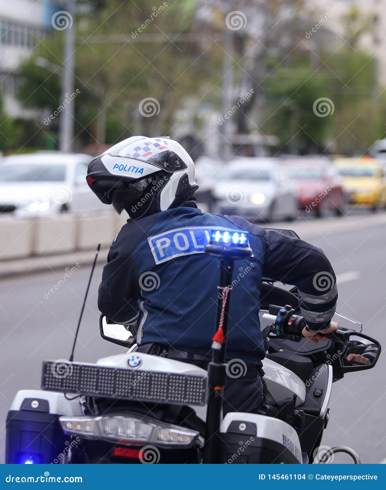 Police Officer Riding a BMW Motorcycle in the Bucharest City Traffic ...