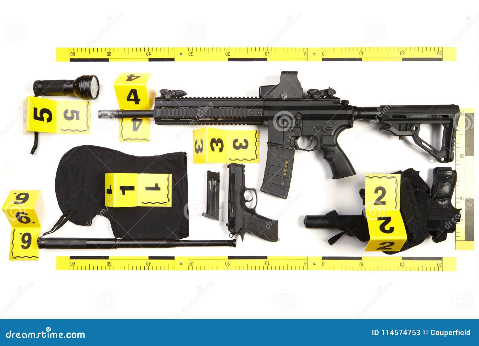 police photo evidence of seized automatic gun and other weapons and contraband