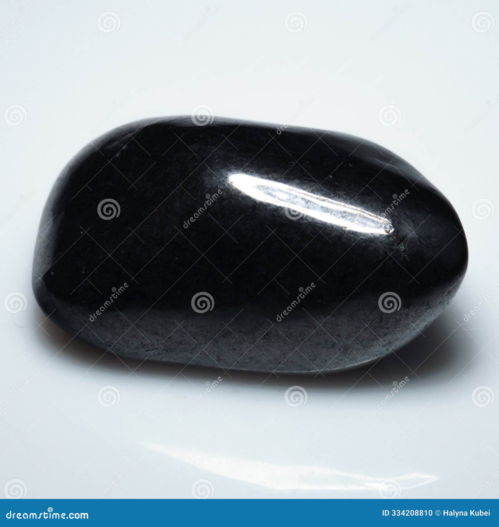 polished elegance: shungite gemstone on pristine white background