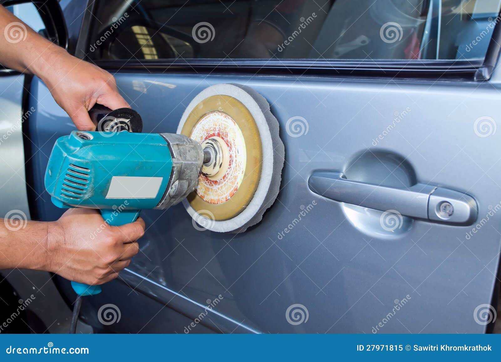 polishing the car with power buffer machine