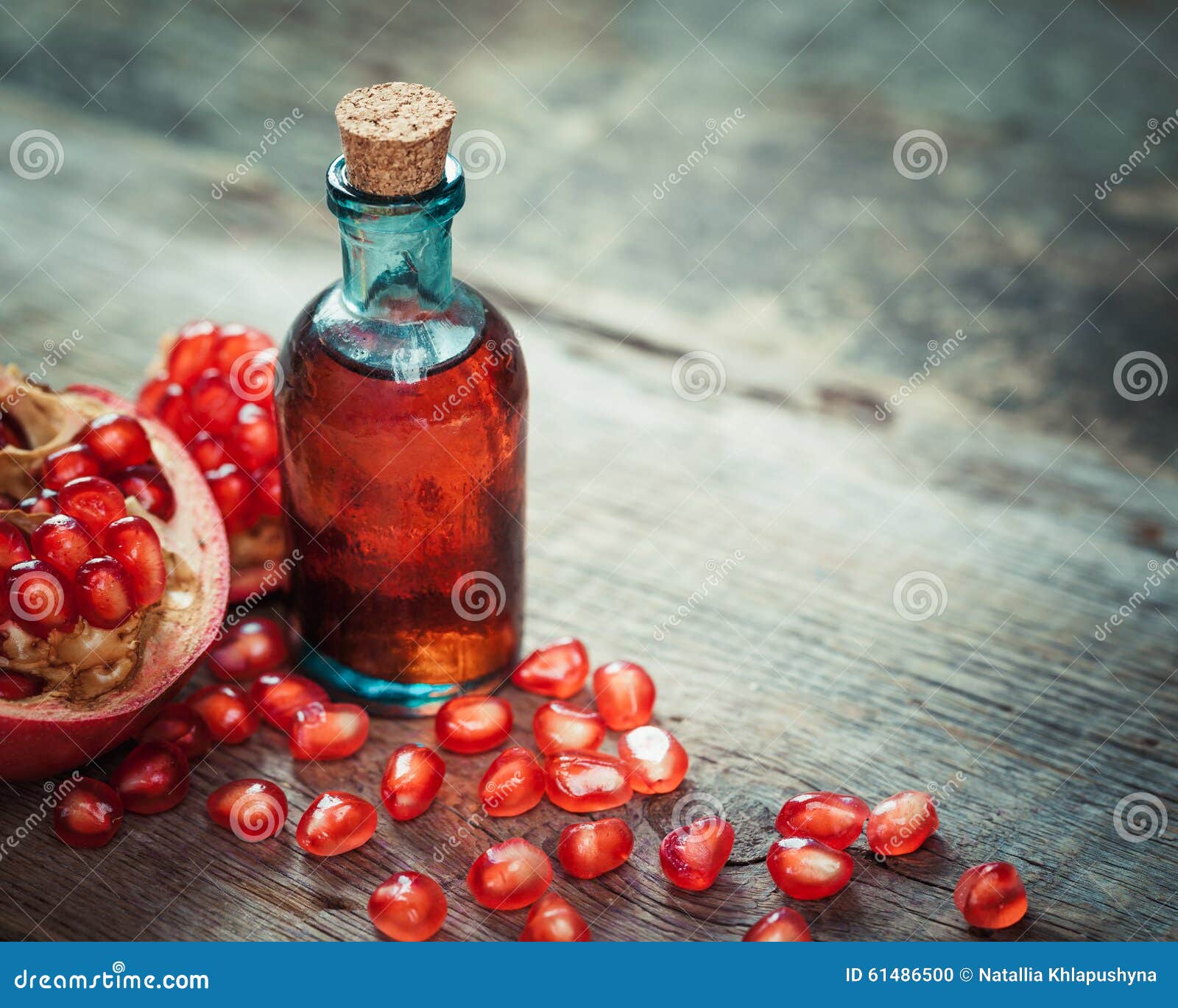 Pomegranate Juice or Tincture and Fruit with Seeds Stock Photo