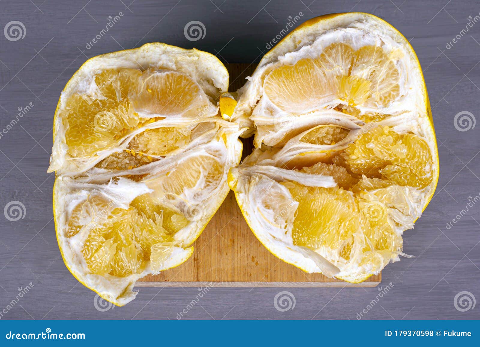 Pomelo Fruit Top View, Halves of Exotic Fruit on Gray Background