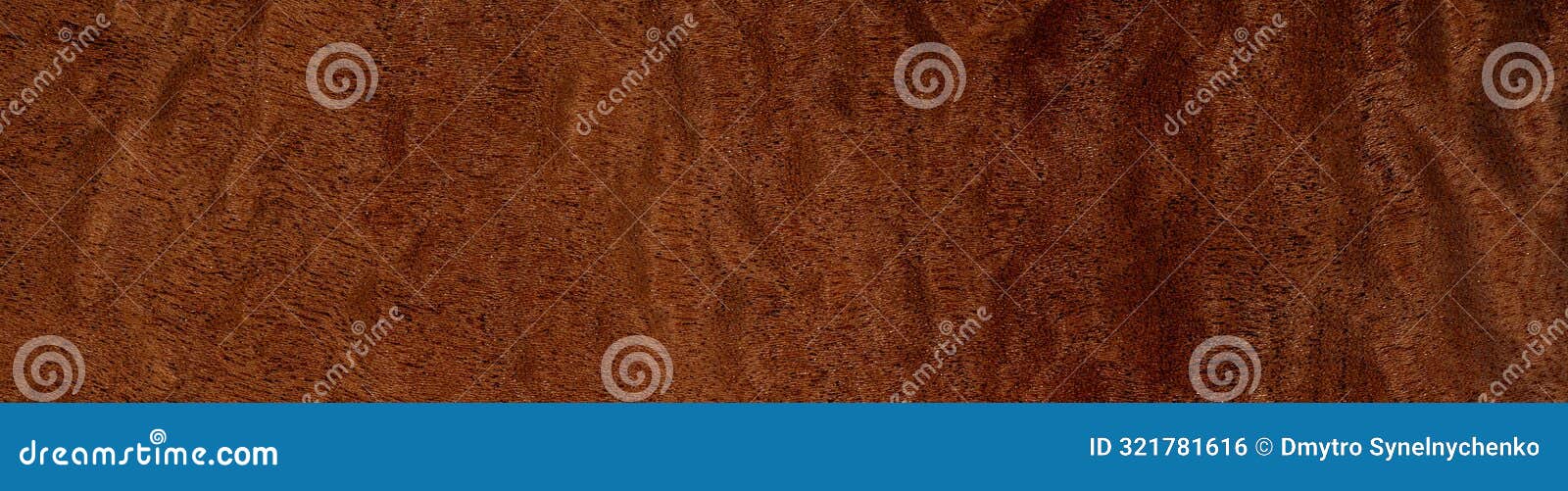 pommele mahogany veneer with intricate swirling patterns and deep copper tones