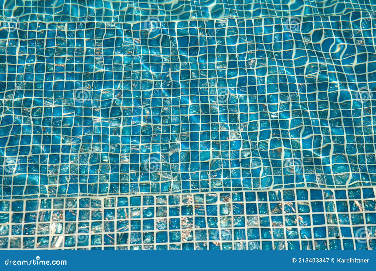 A Pool With Blue Ceramic Tiles And Water Ripple Effect Refection Of
