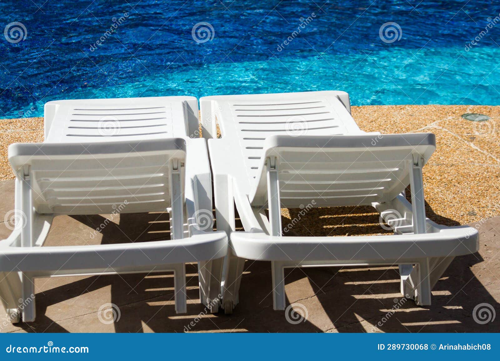 Pool chairs stock photo. Image of sunlight, white, plastic 289730068
