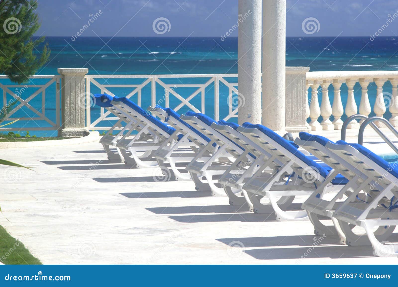 Pool Lounge Chairs 2 stock image. Image of holiday, chair - 3659637
