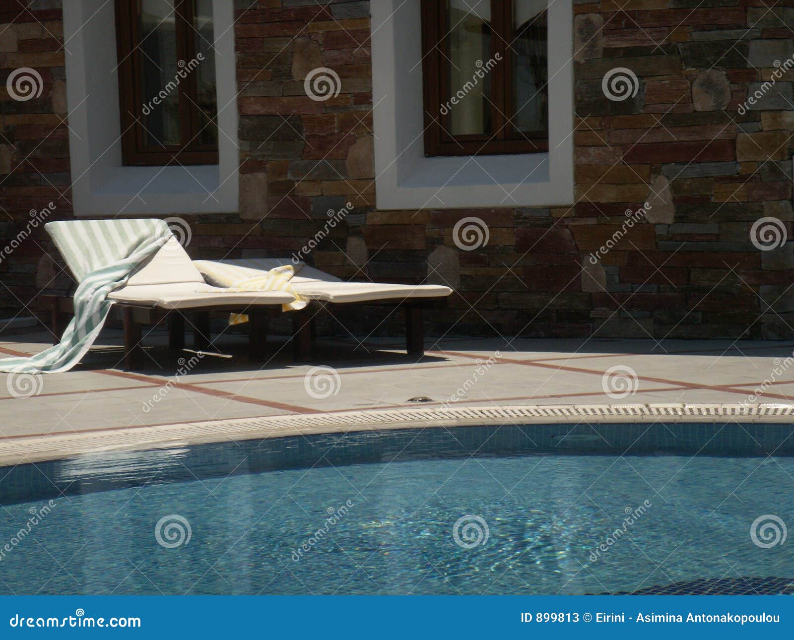 Pool sunbeds stock image. Image of motels, greek, chairs 899813
