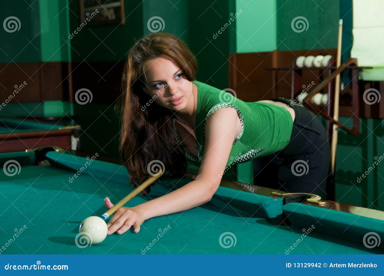 On the pool table.