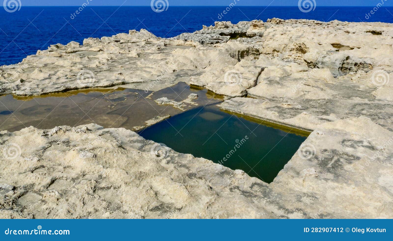 Pools Carved into the Stone Shore on the Island of Gozo, Malta Stock
