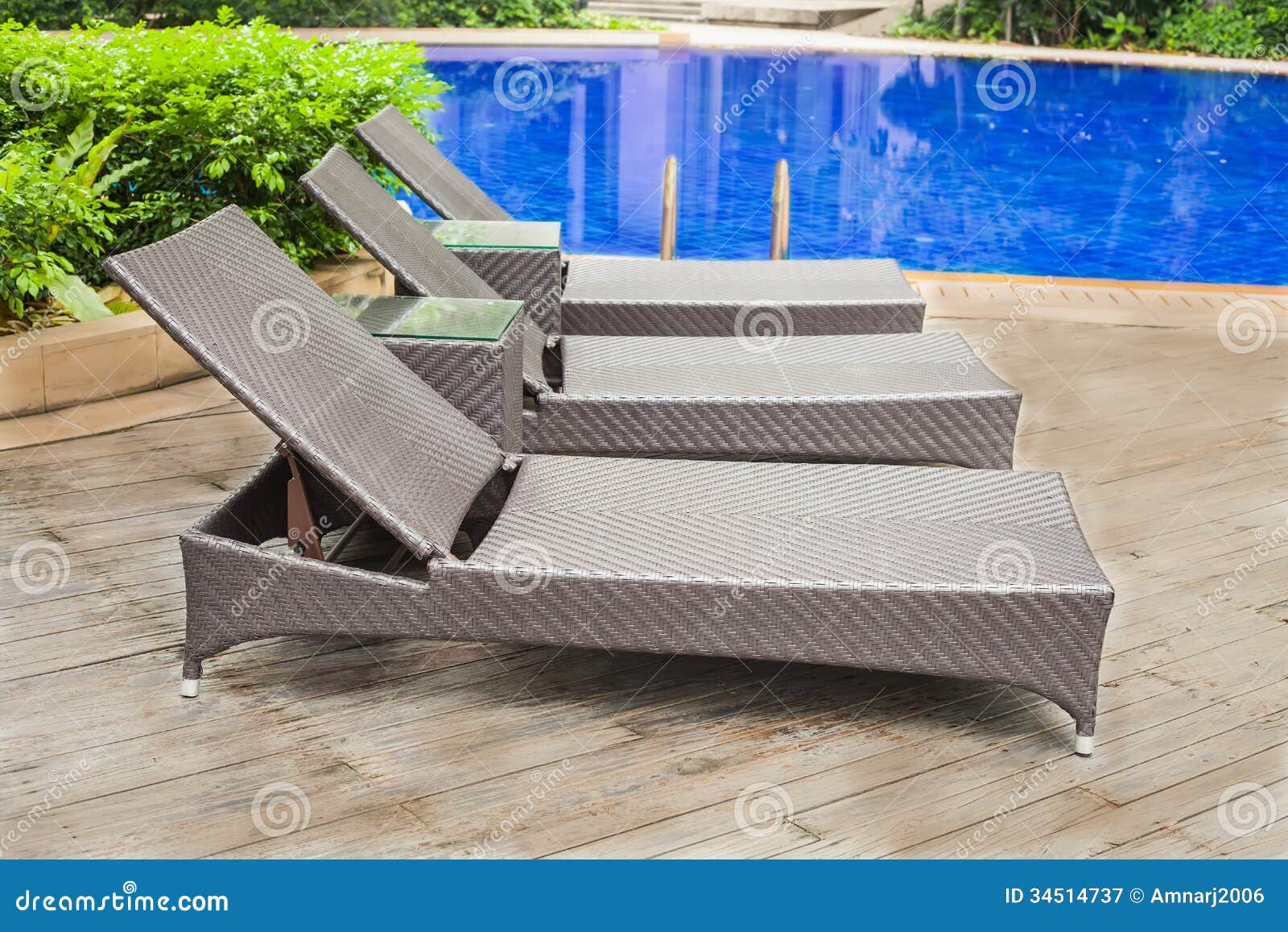 Poolside loungers stock image. Image of resort, leisure 34514737