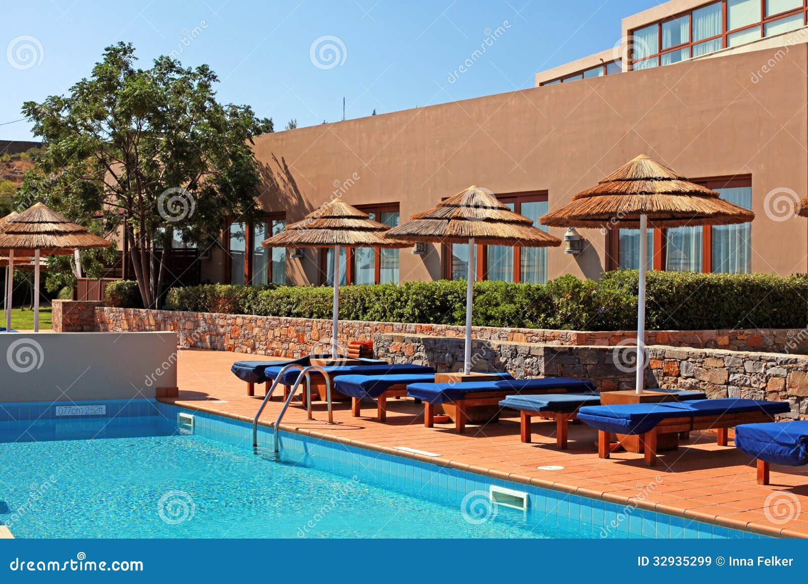 Poolside With Pool Bed And Umbrella In Summer Resort Stock 