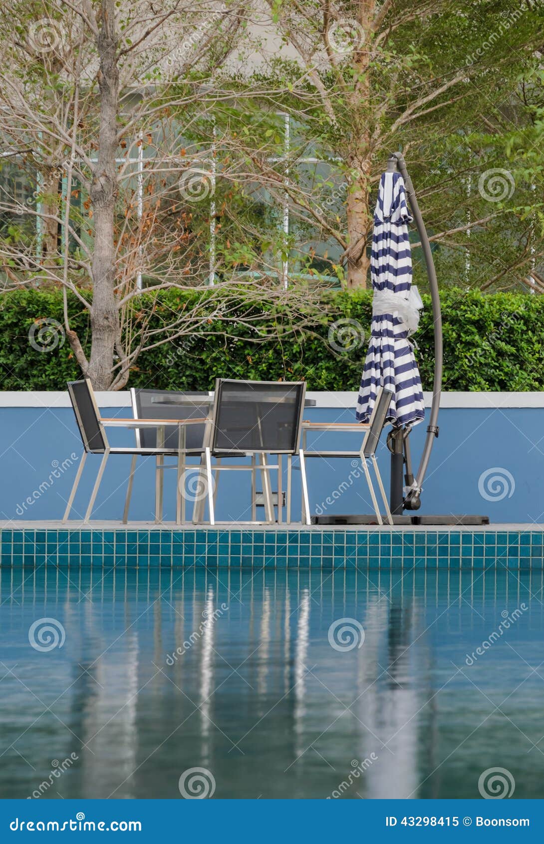Poolside table and chairs stock image. Image of parasol 43298415