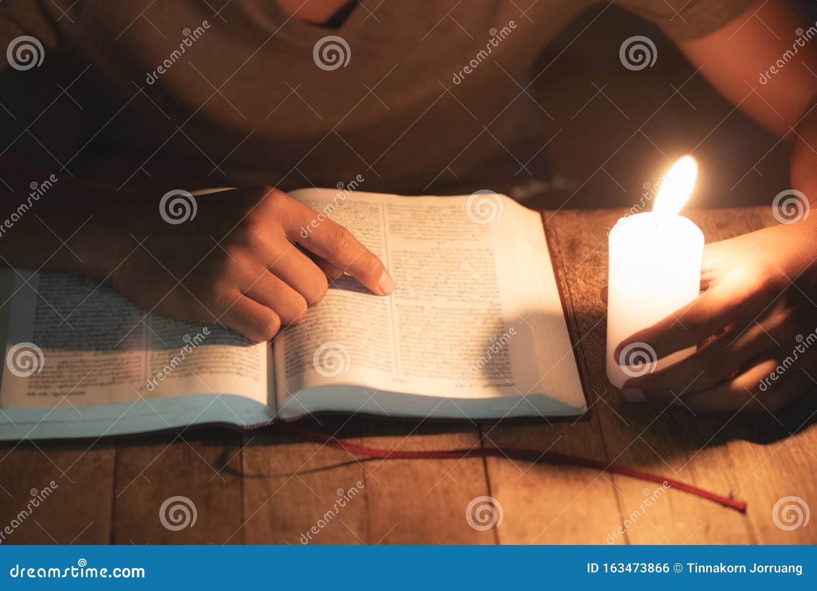 poor children read books using candles for lighting., disadvantaged children doing homework, education concept
