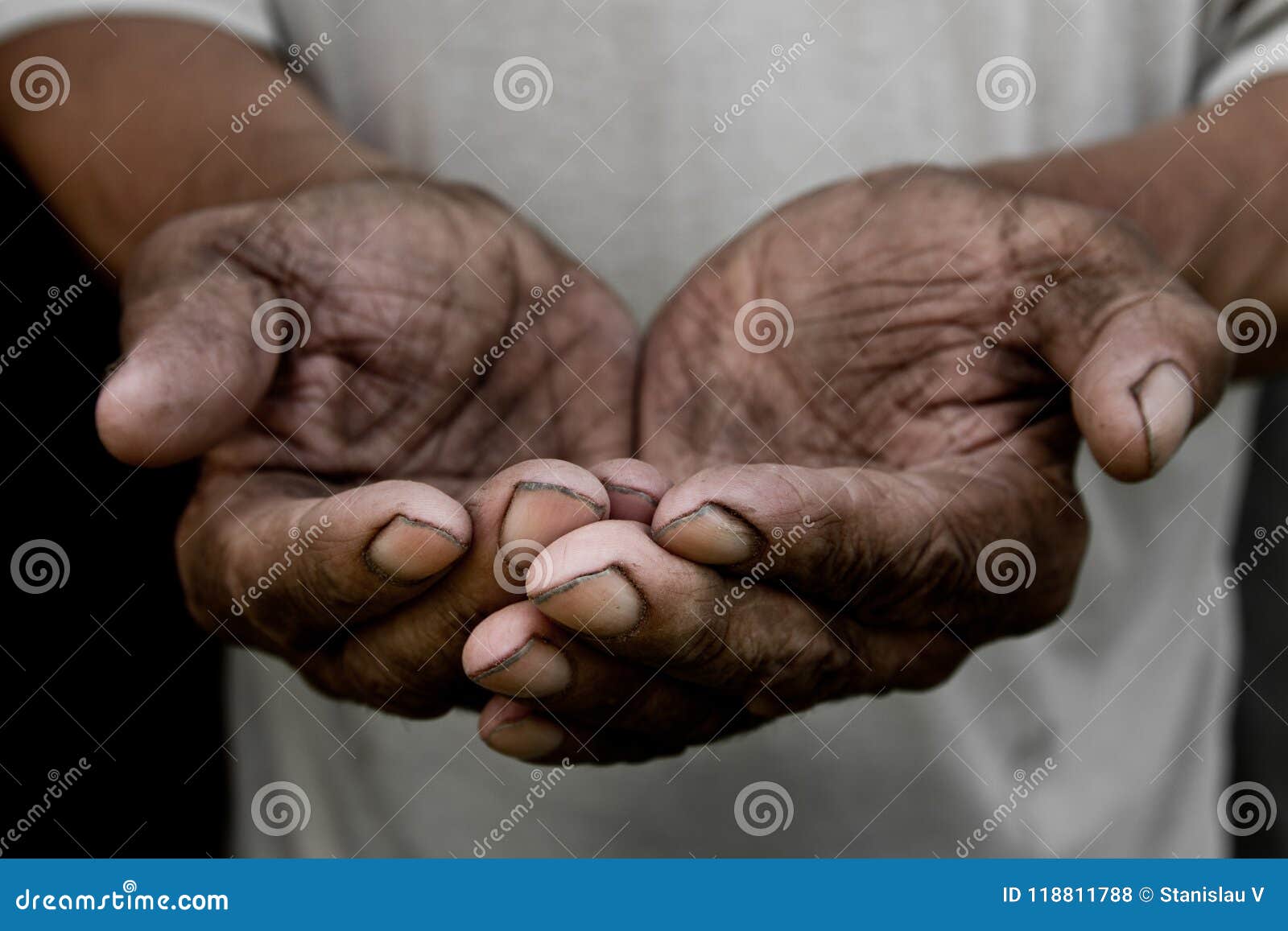 the poor old man`s hands beg you for help. the concept of hunger or poverty.