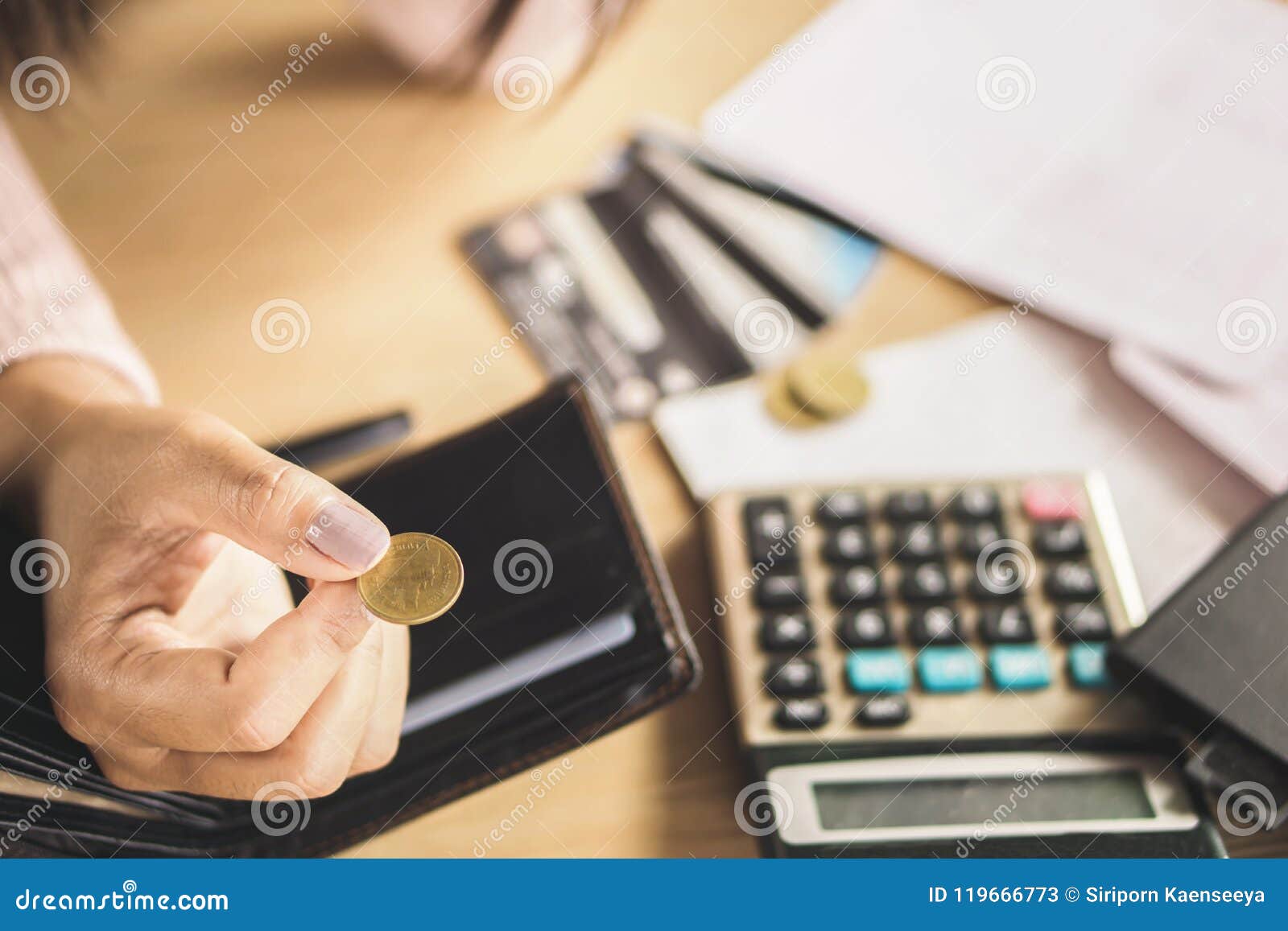 poor woman hand holding coin after payday, bankruptcy broke