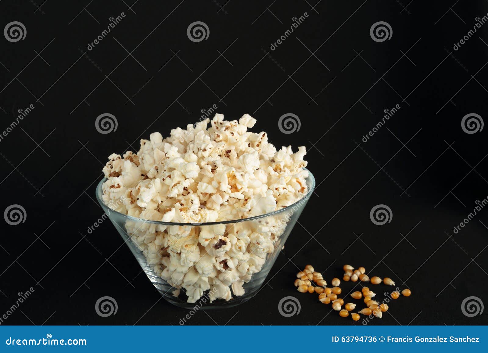 Popcorn in a glass bowl stock photo. Image of popcorn 63794736