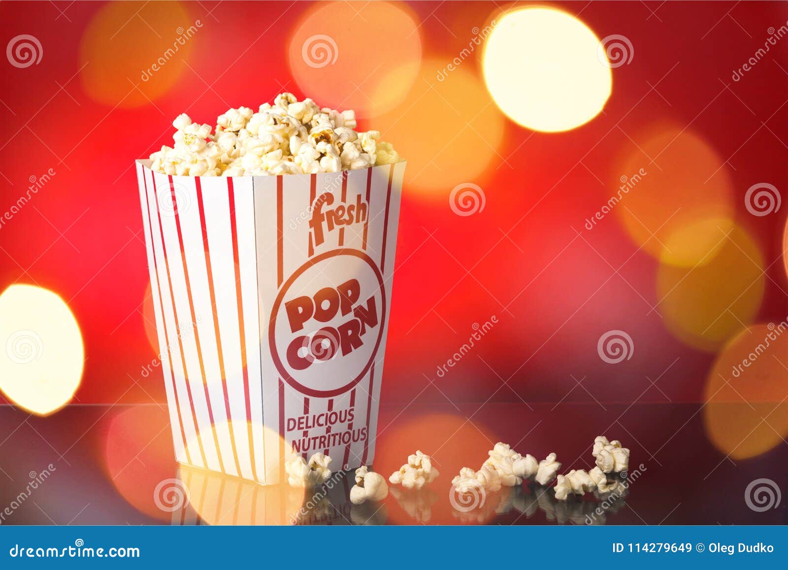 Popcorn on a the table stock image. Image of paper, back 114279649