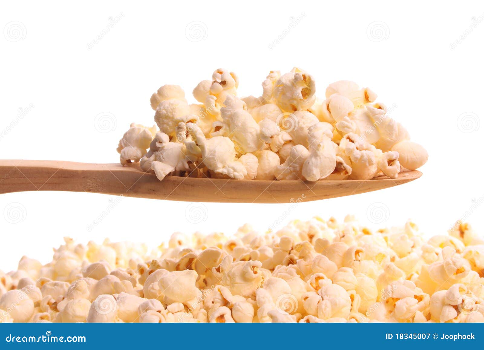 Popcorn on a wooden spoon stock image. Image of offering 18345007