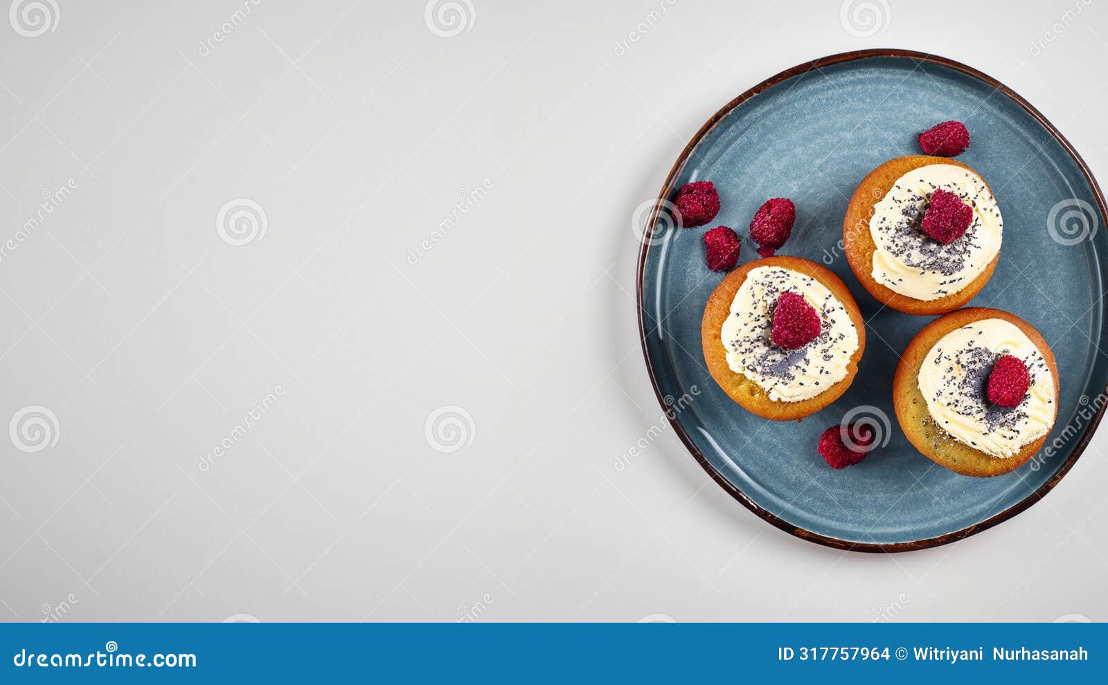 poppy seed cupcakes with cream cheese frosting, sprinkled with freeze dried raspberries. generative ai