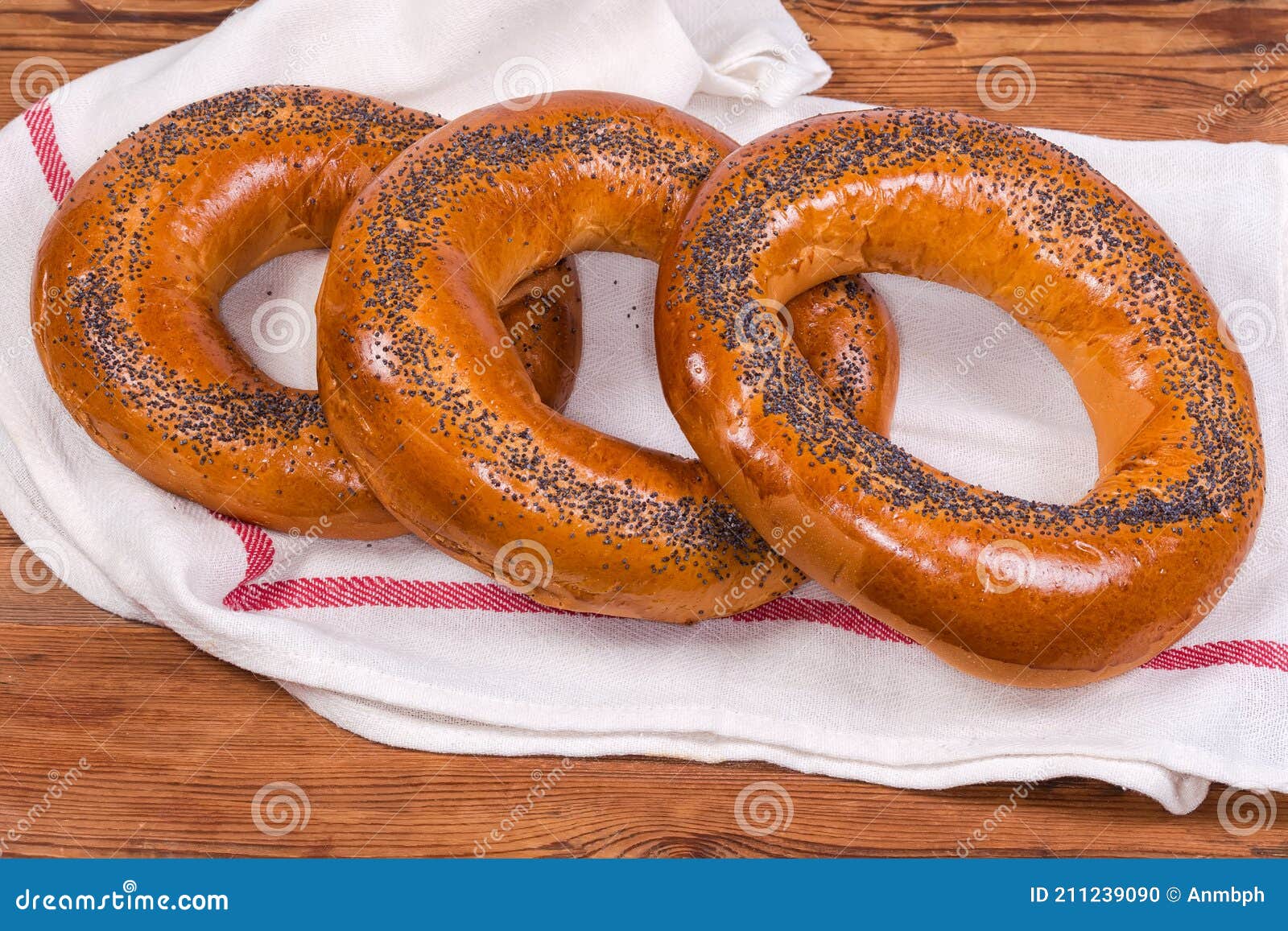 poppy seed ring-d bread rolls on a napkin