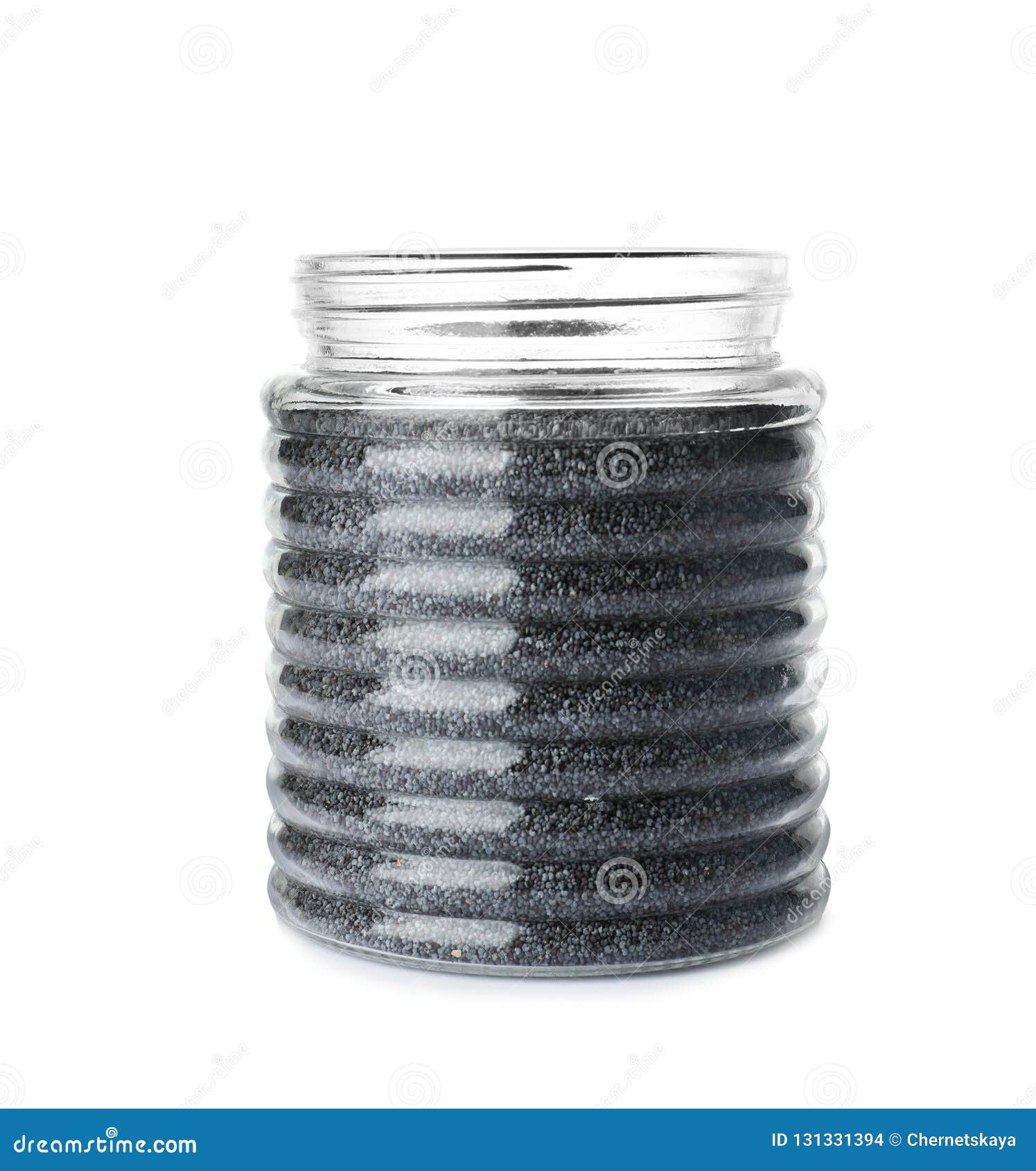Poppy seeds in glass jar stock photo. Image of grain 131331394