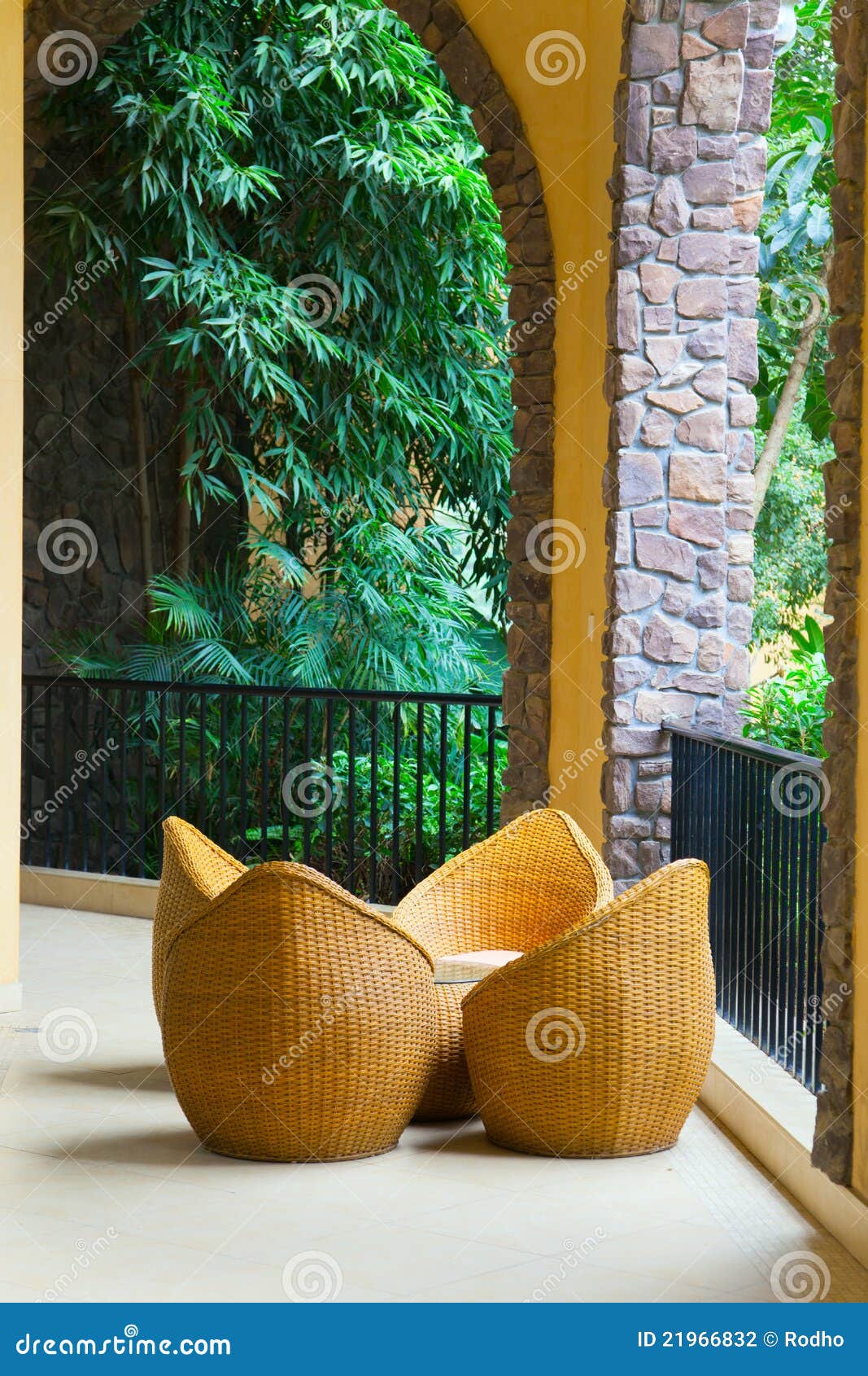 Porch with rattan chairs stock photo. Image of bush, patio 21966832