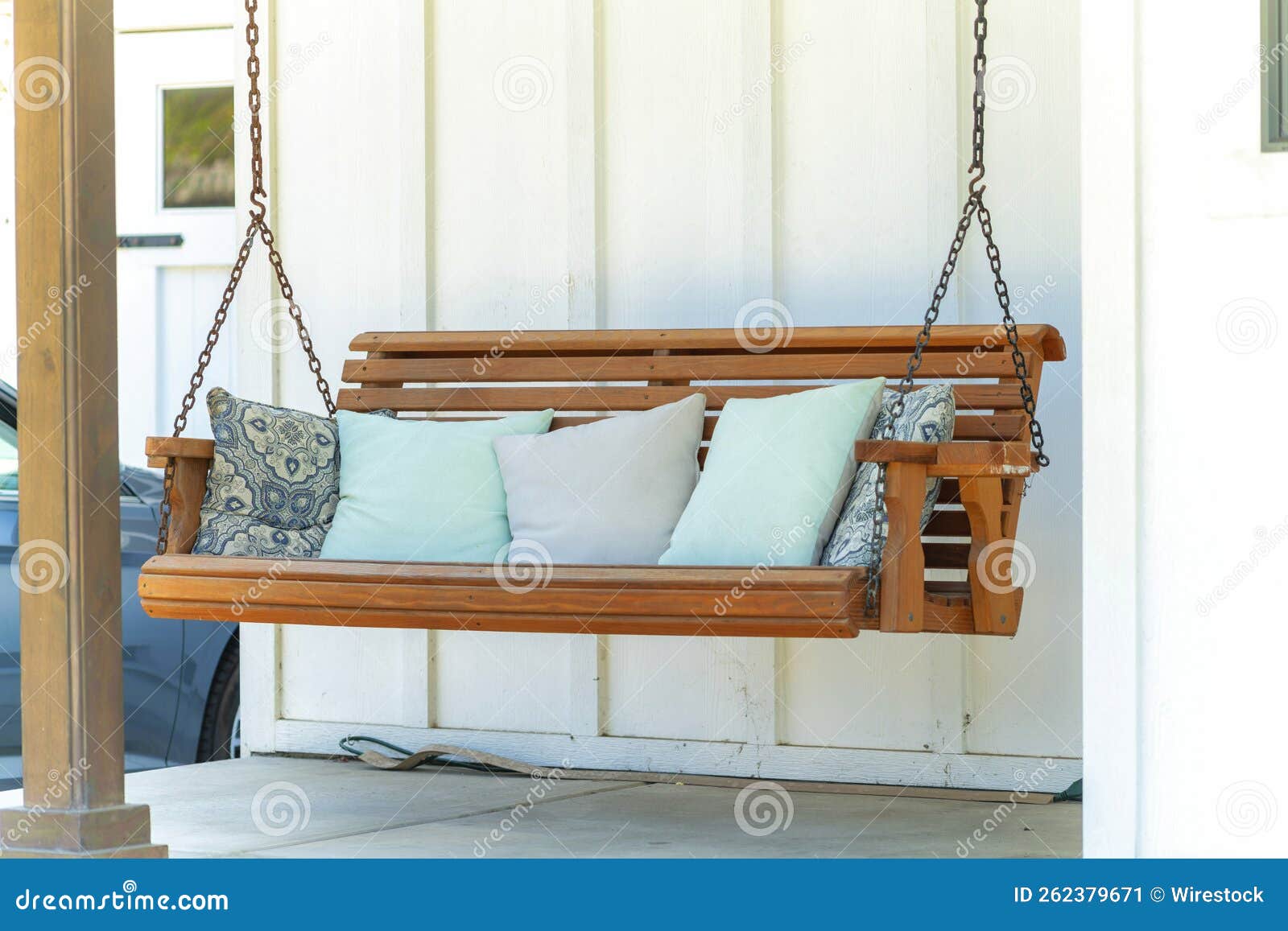 Porch Swing with Comfortable Pillows in a Patio Stock Image Image of