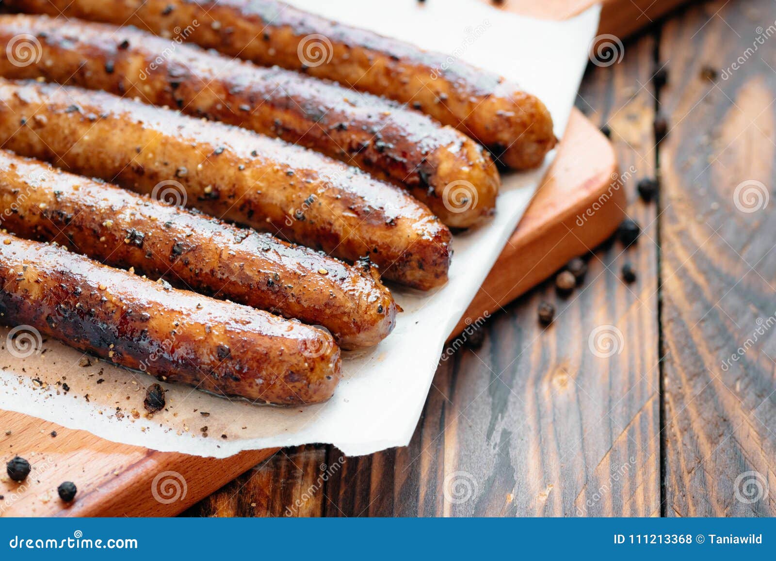 pork chipolata. close-up view of fried sausages. meat dish