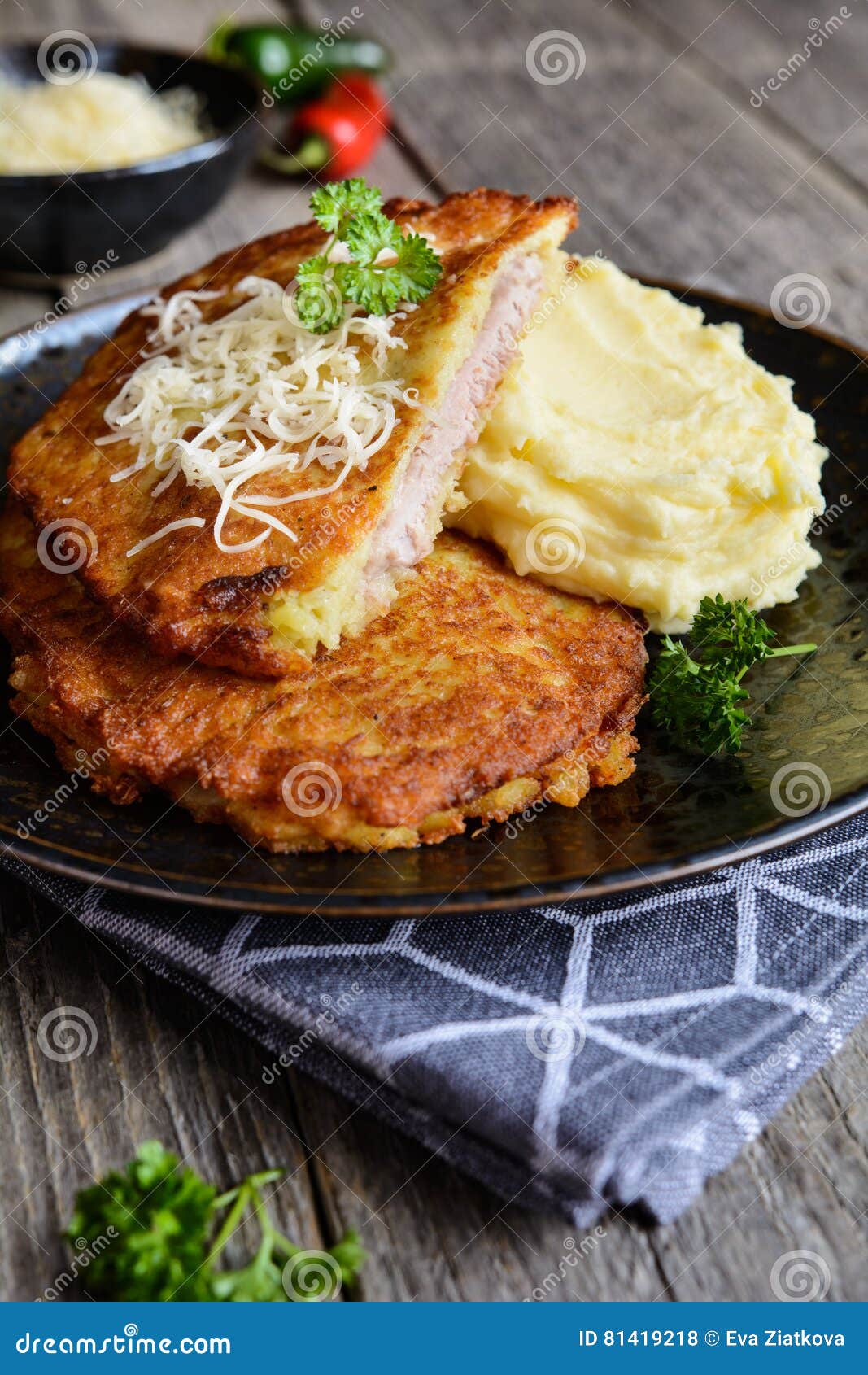 Pork Cutlets Coated in Potato Batter, Studded with Cheese and Served with Mashed Potato Stock